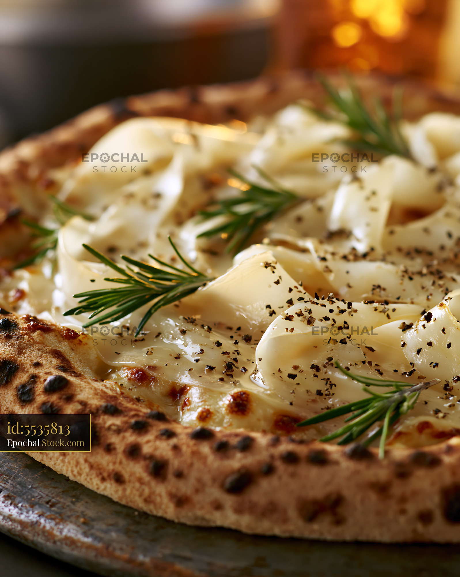 Artisanal panna mais pizza with fresh rosemary and cracked pepper - stock photo