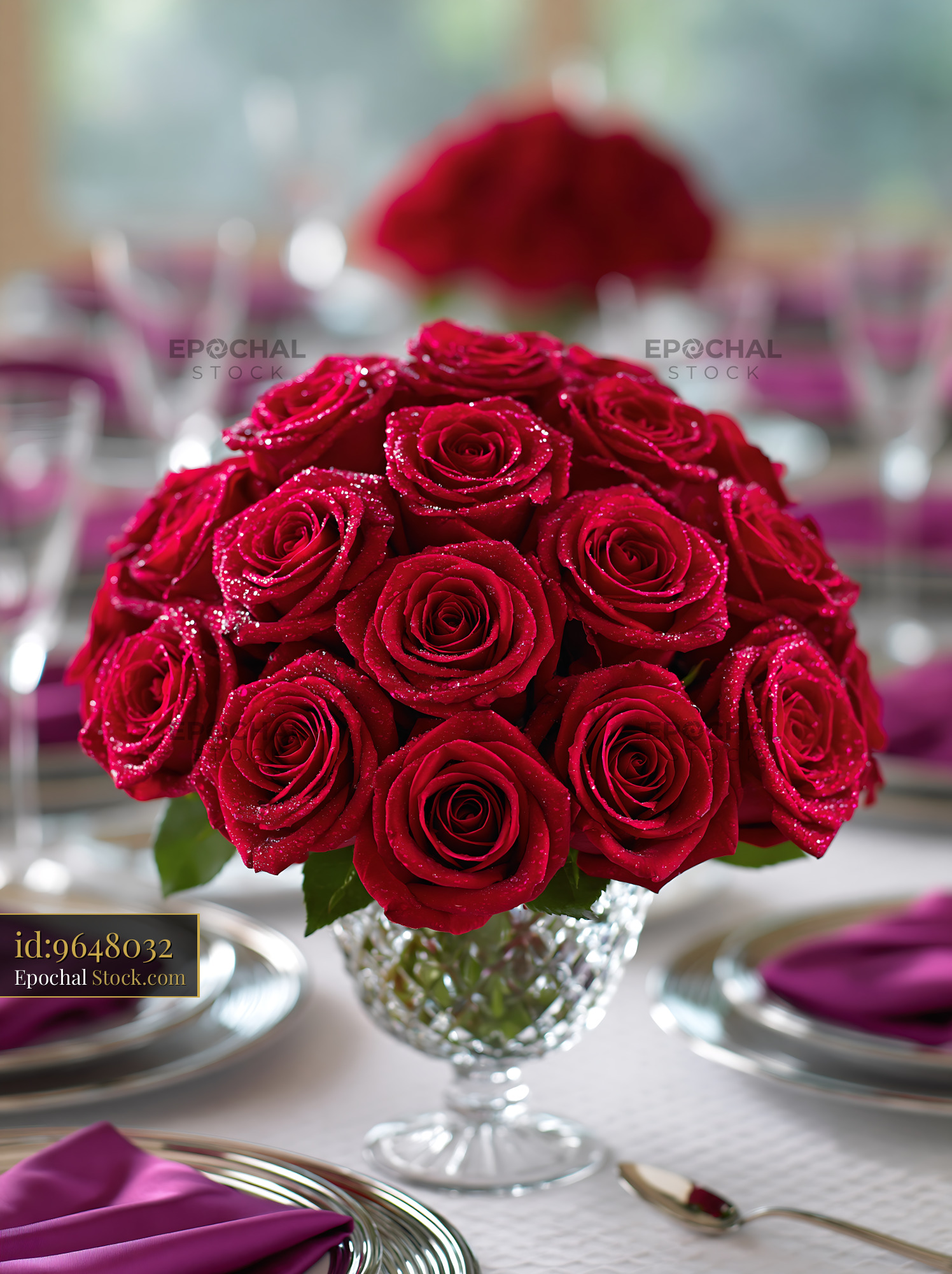 Elegant red roses centerpiece on a luxury gala dinner table - stock photo