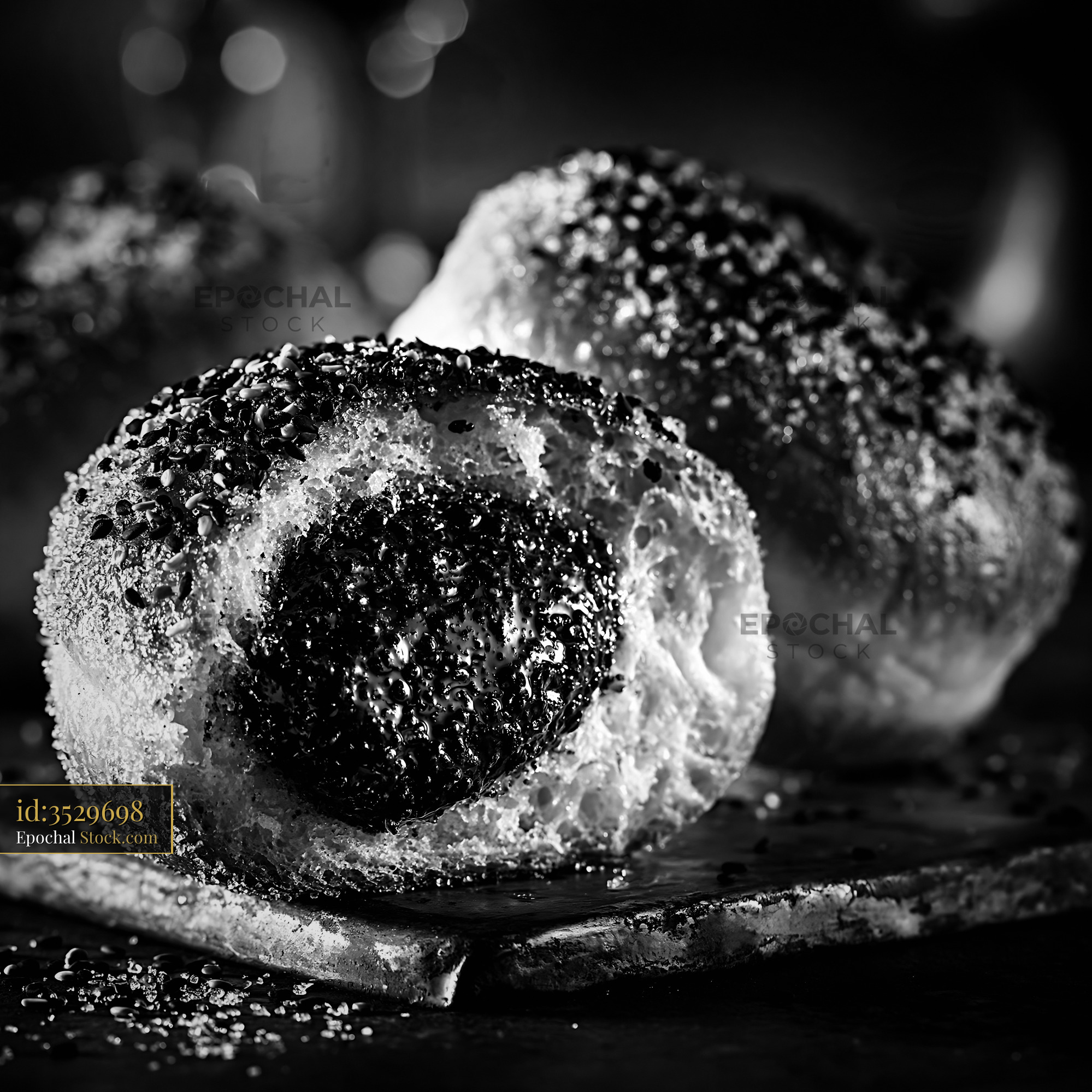 Artisan black sesame paste filled donuts with sugar and seeds - stock photo