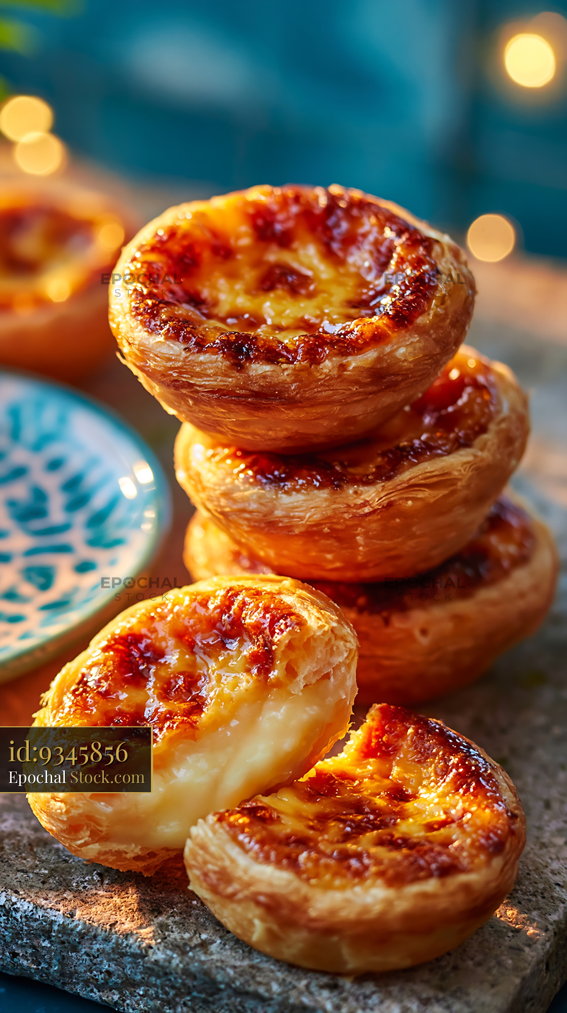 Stack of fresh Portuguese custard tarts with creamy filling - stock photo