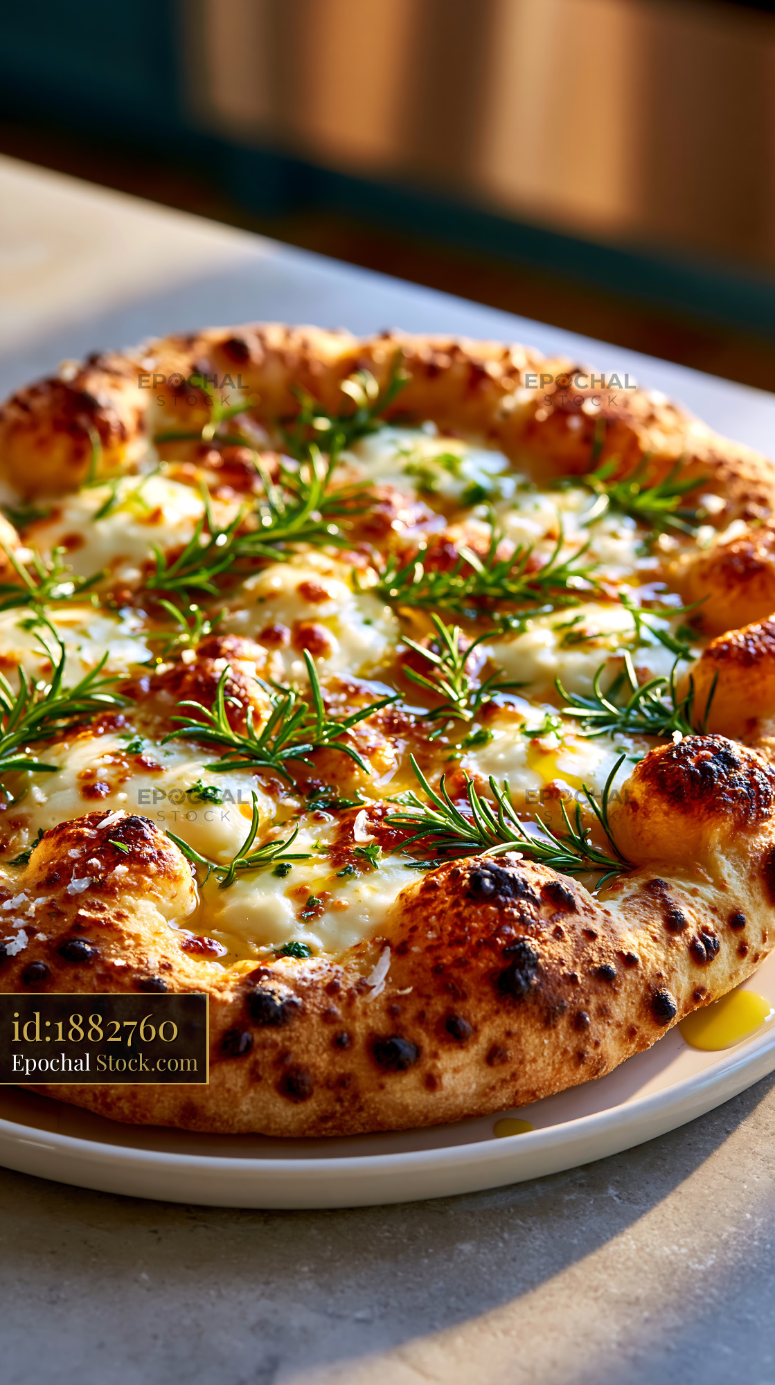 Artisanal pizza bianca with fresh rosemary and melted cheese - stock photo