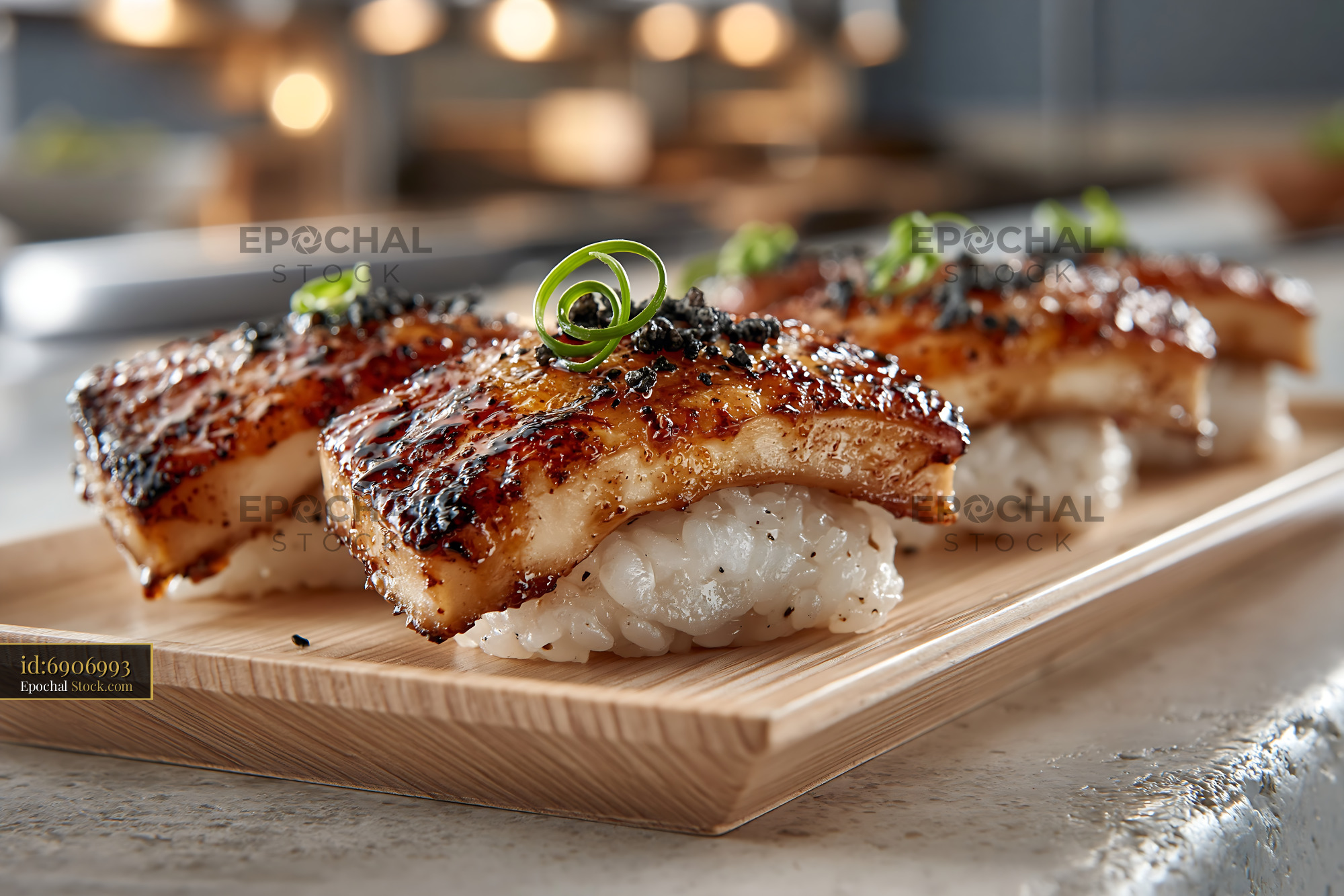 Gourmet king oyster mushroom sushi with glazed tops on a wooden tray - stock photo