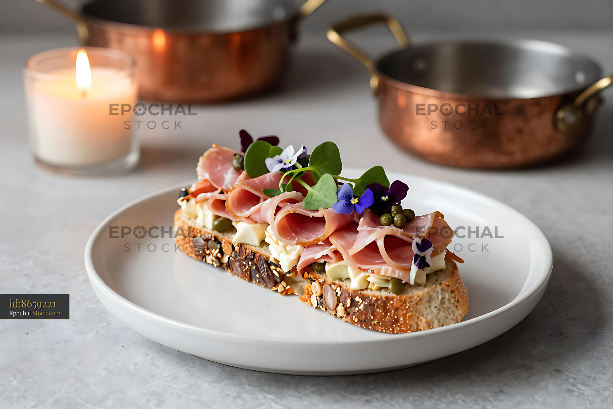 Gourmet Danish skinkesalat on rugbrod with ham and edible flowers - stock photo