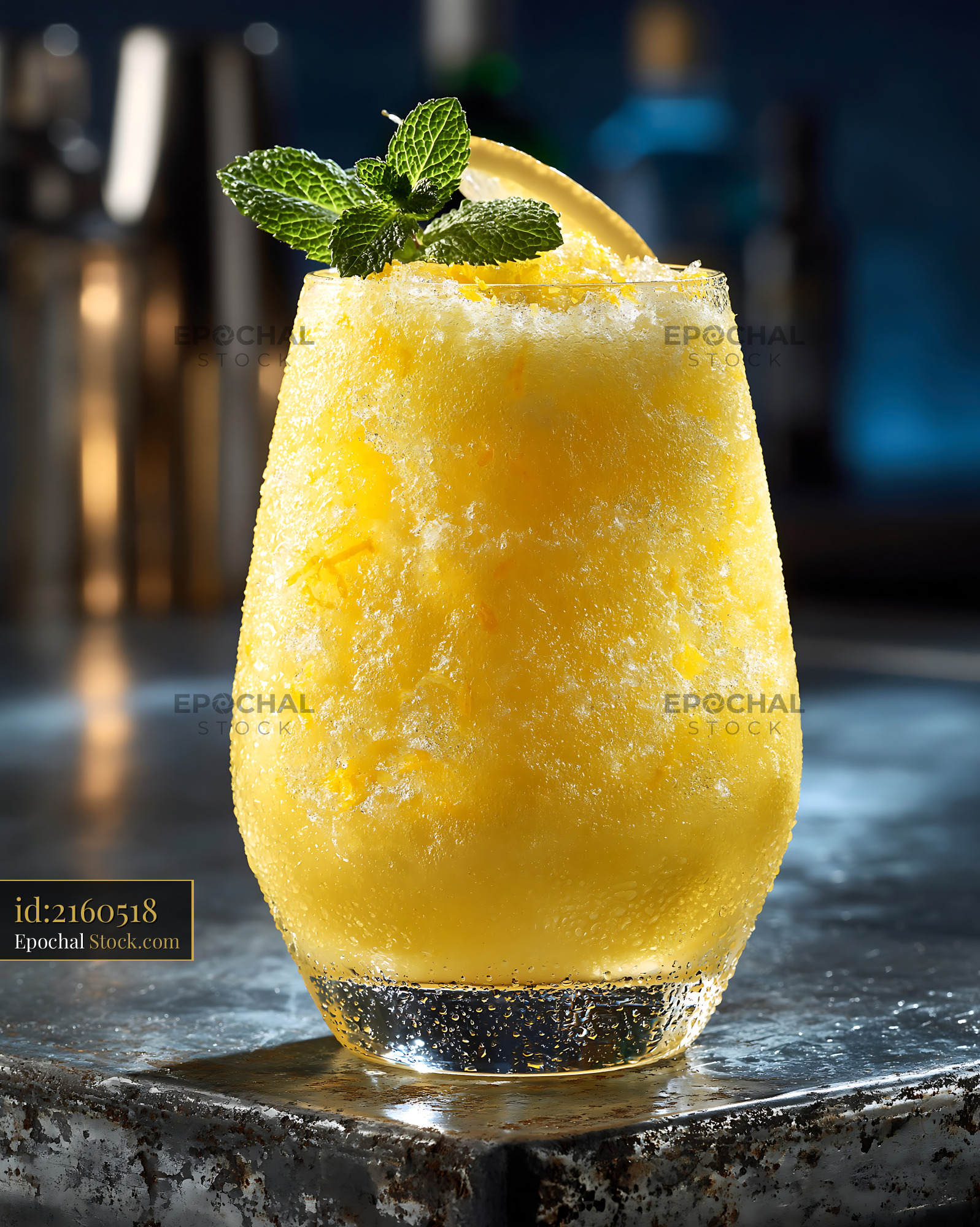 Yuja citron smoothie with fresh mint on a dark bar counter - stock photo