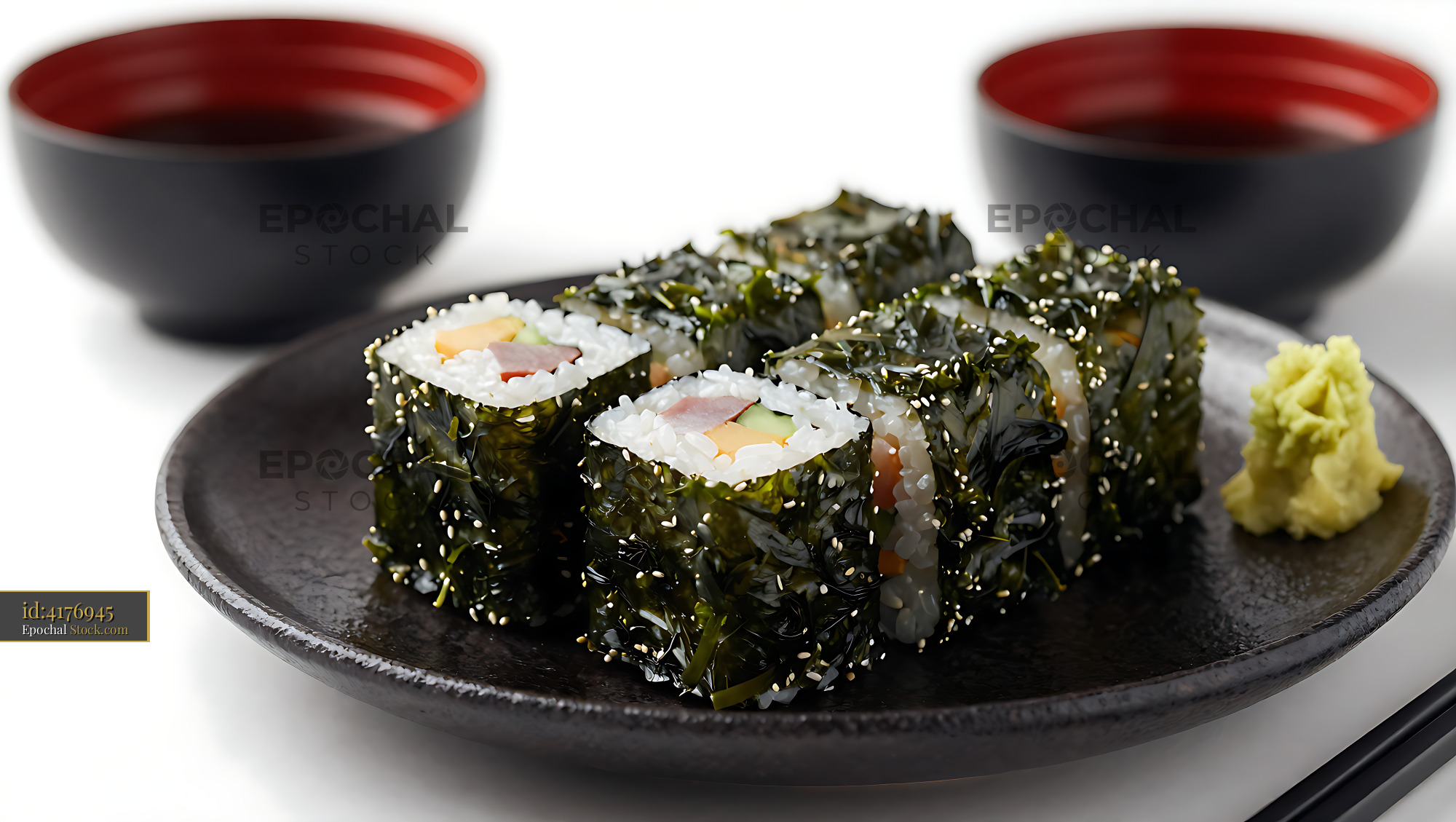 Tororo Konbu Maki sushi rolls wrapped in shredded kelp on a plate - stock photo