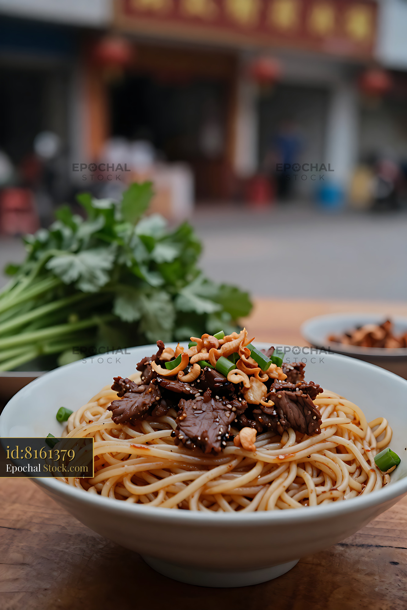 Chao Zhou Sha Cha Niu Rou Mian served on a rustic wooden table - stock photo