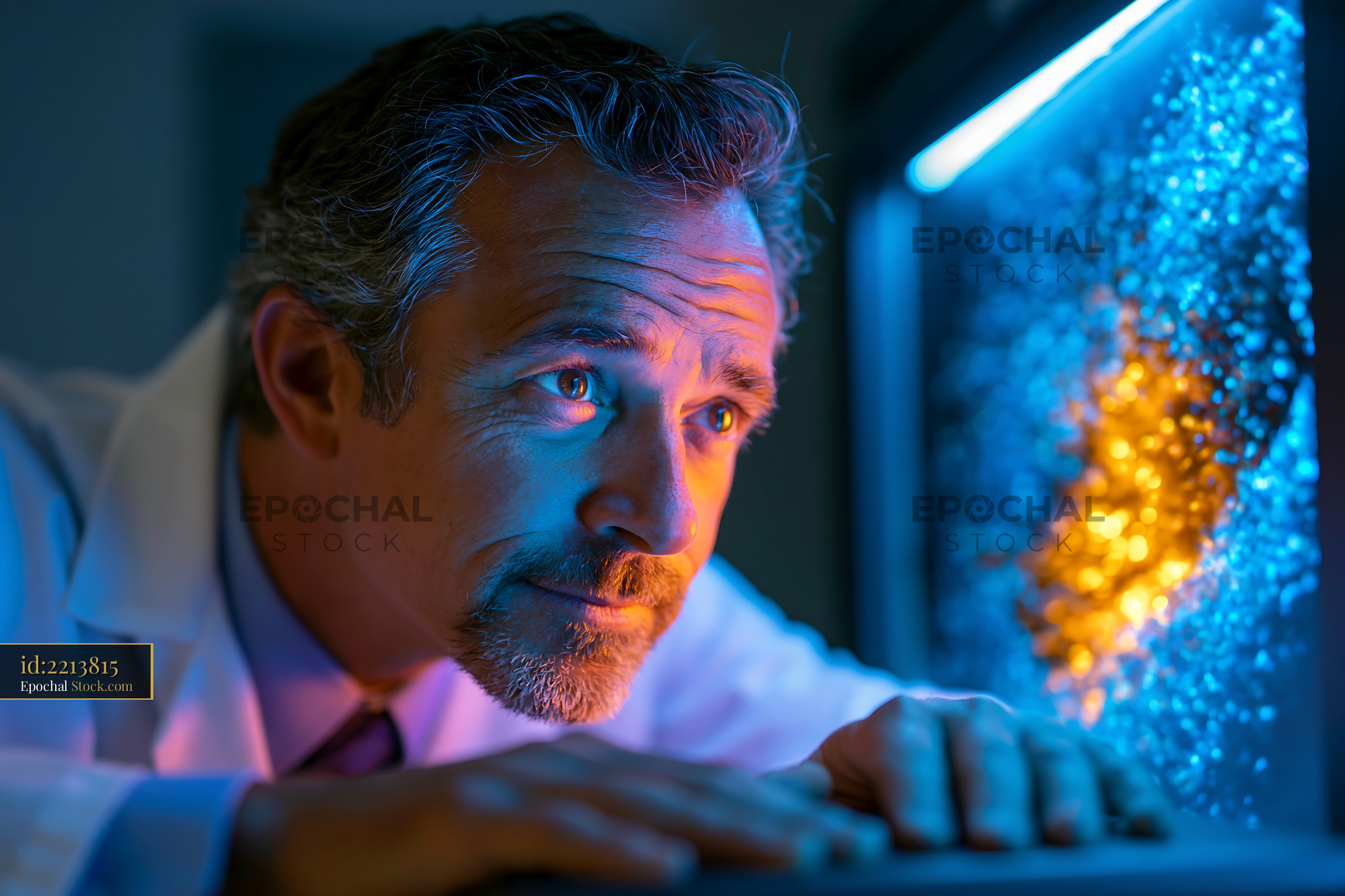 Mature scientist analyzing dynamic ratiometric fret imaging data - stock photo