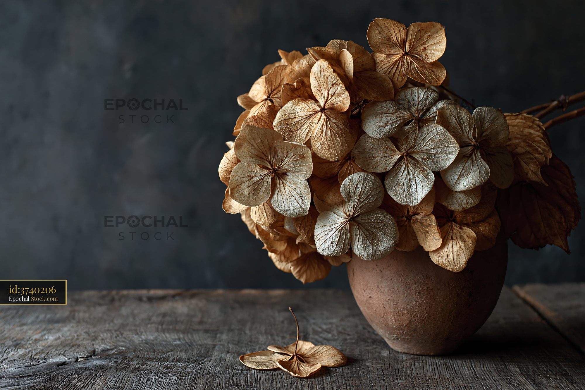 Dried hydrangea bouquet in a clay pot on a rustic wooden table - stock photo