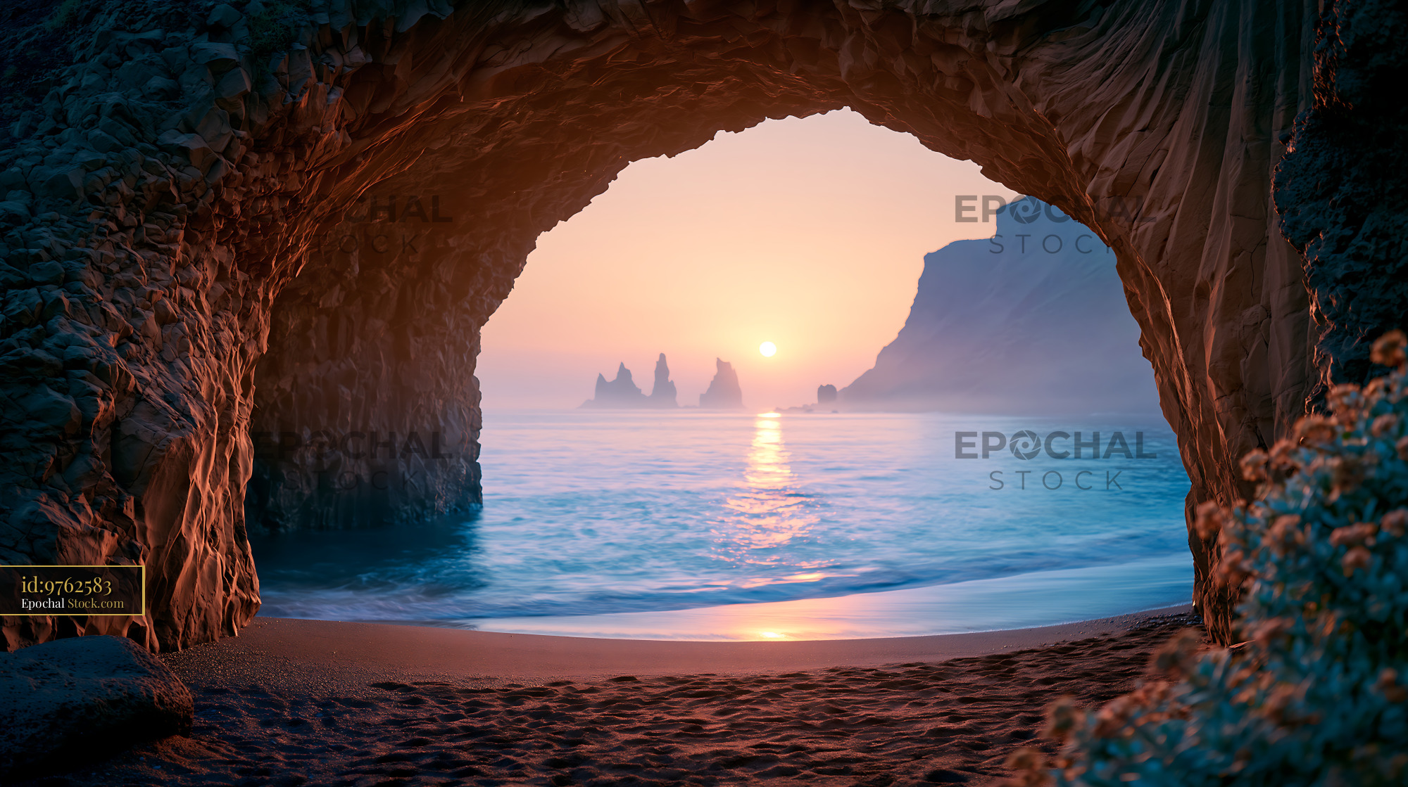 Scenic view of sunset over the ocean from inside a coastal sea cave - stock photo