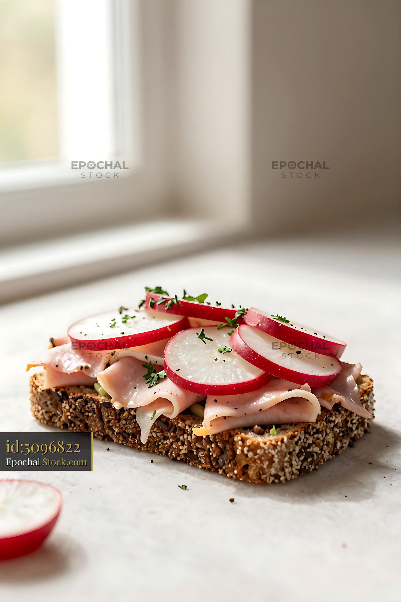 Danish ham and radish open-faced sandwich on seeded rye bread - stock photo
