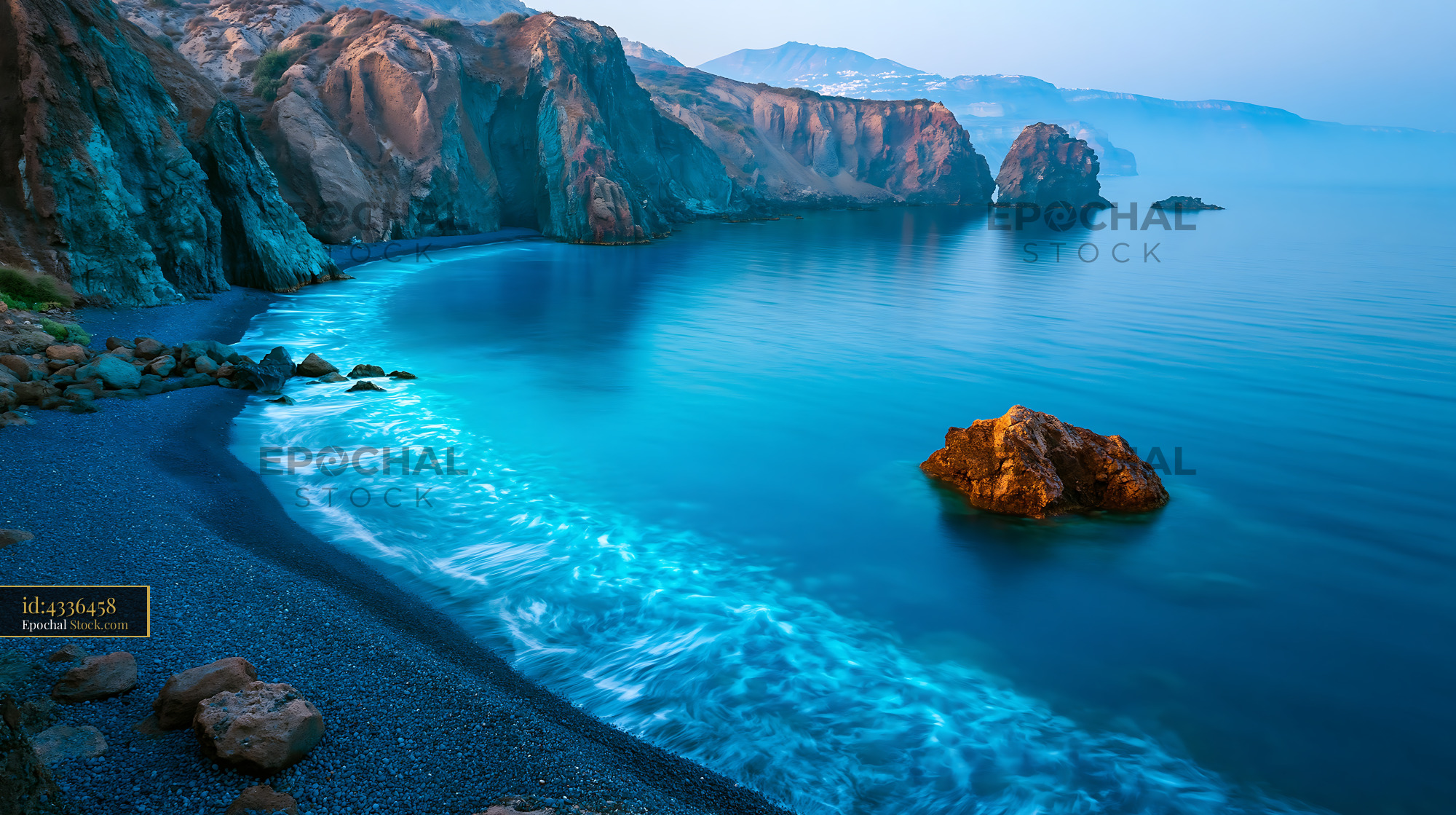 Santorini volcanic caldera beach view with turquoise water and cliffs - stock photo