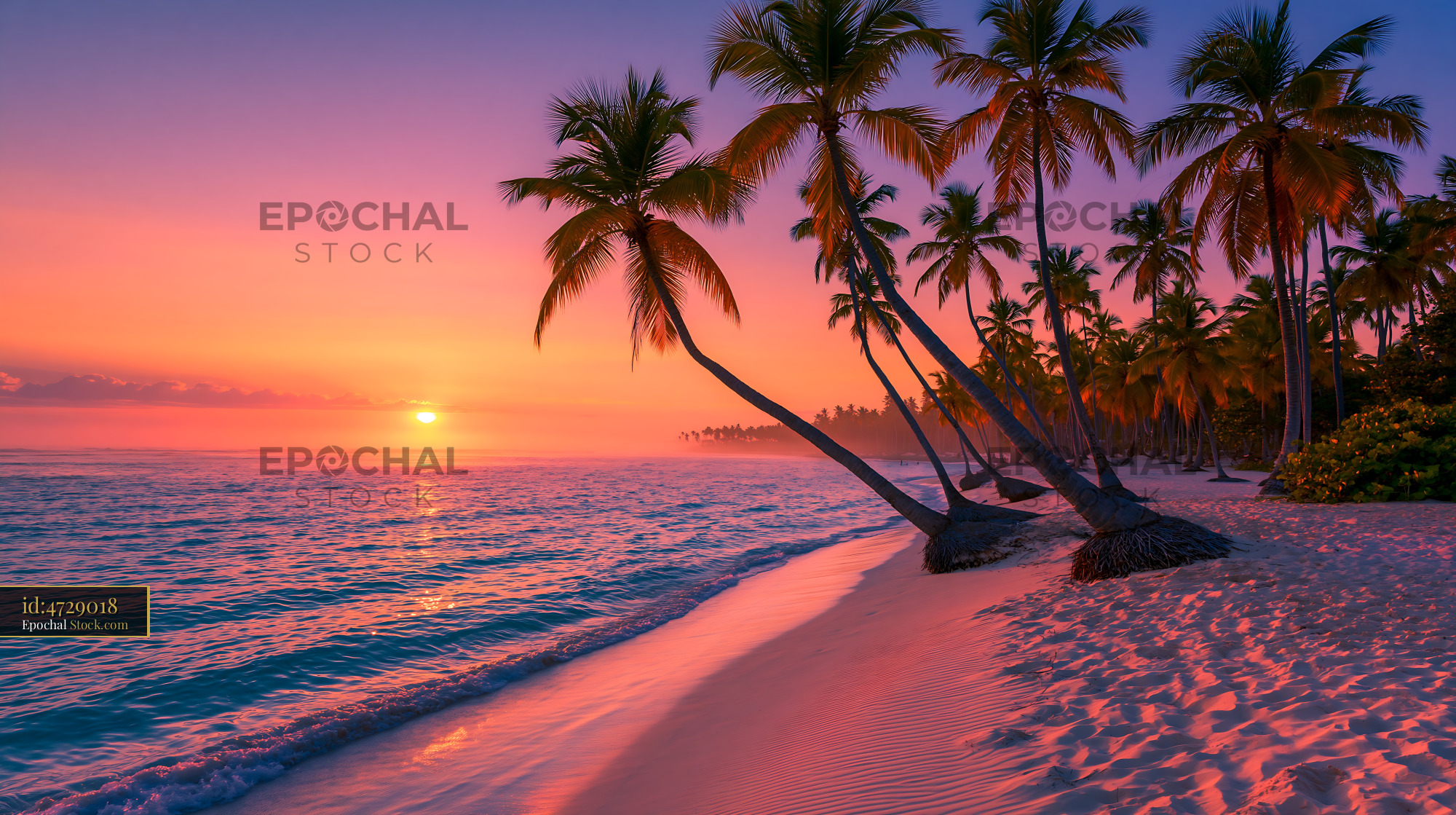 Tropical beach with leaning palm trees at vibrant sunset - stock photo