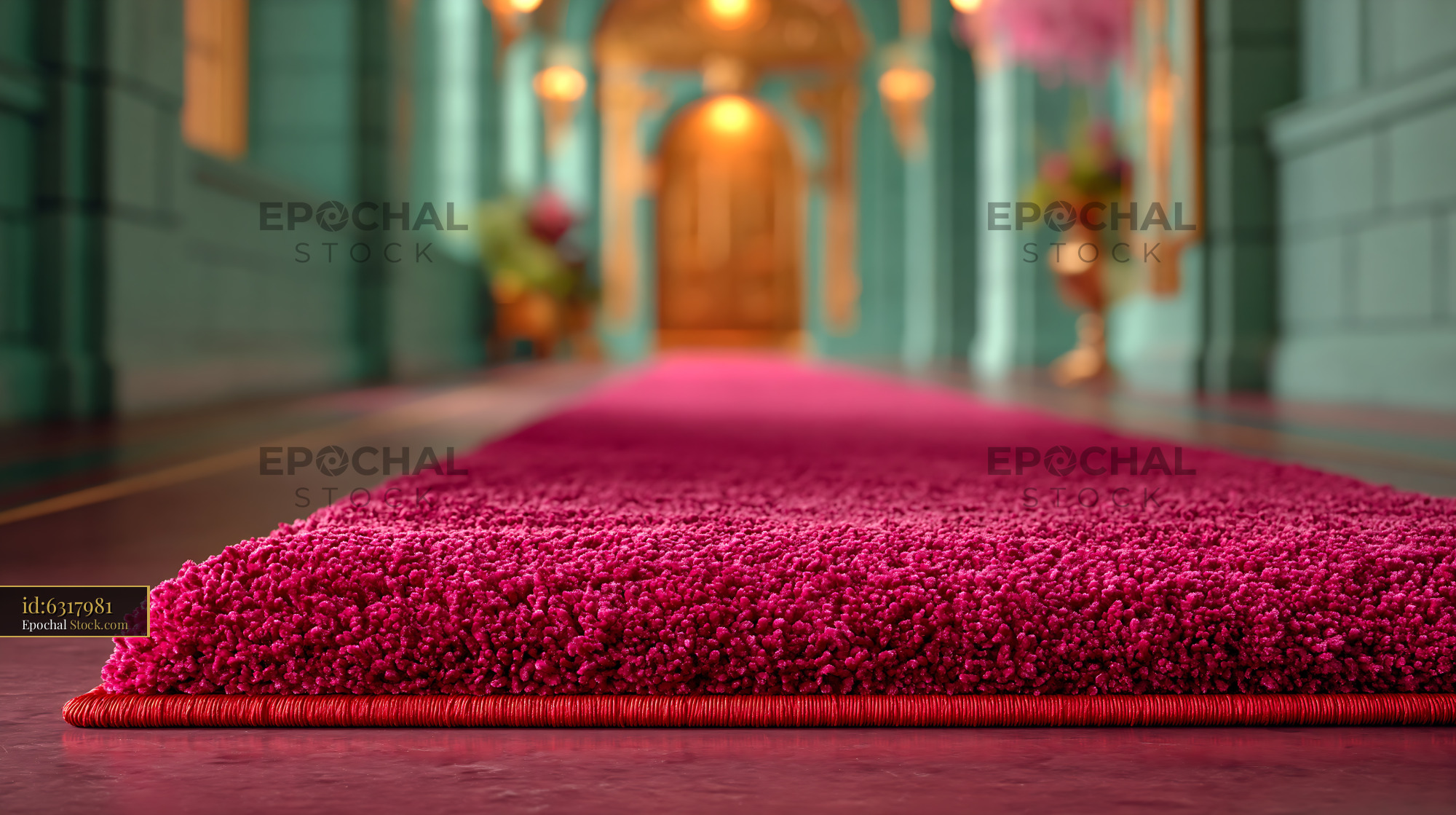 Pink carpet runner in a luxury hallway leading to a golden door - stock photo
