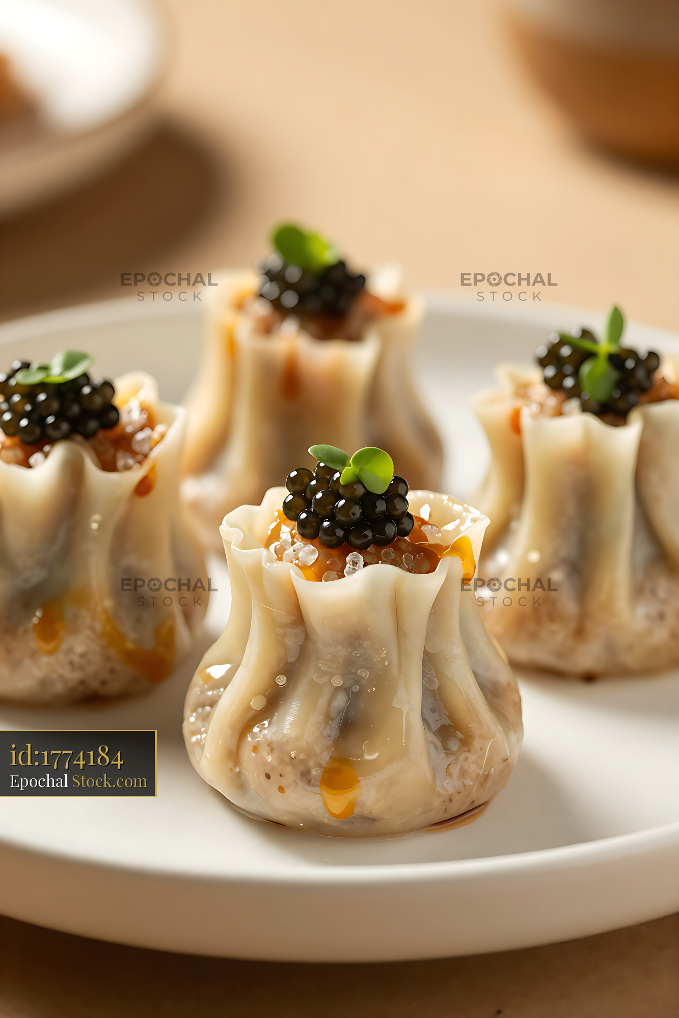 Luxury Wagyu beef shumai dumplings topped with black caviar - stock photo