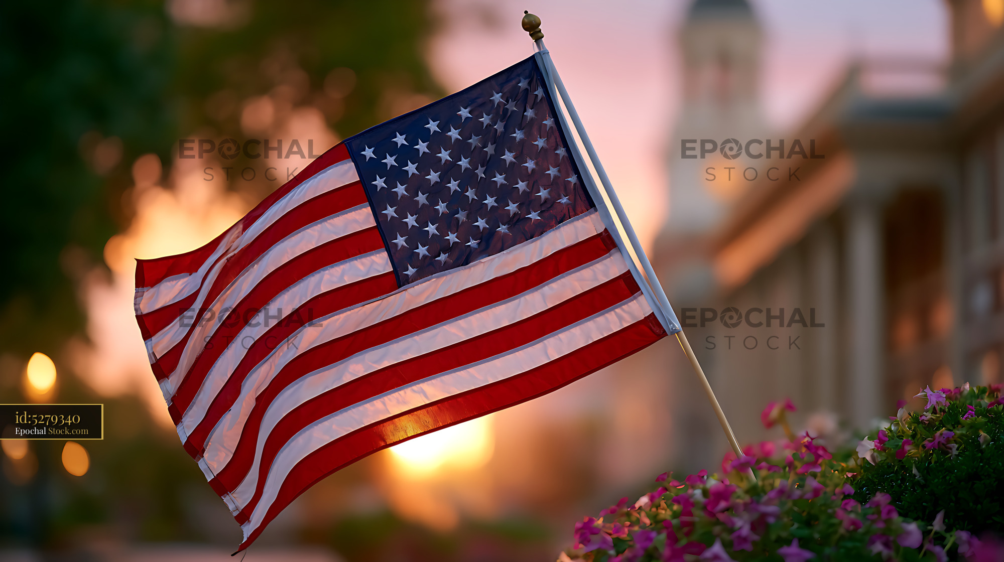 American flag waving in front of Independence Hall at sunset - stock photo