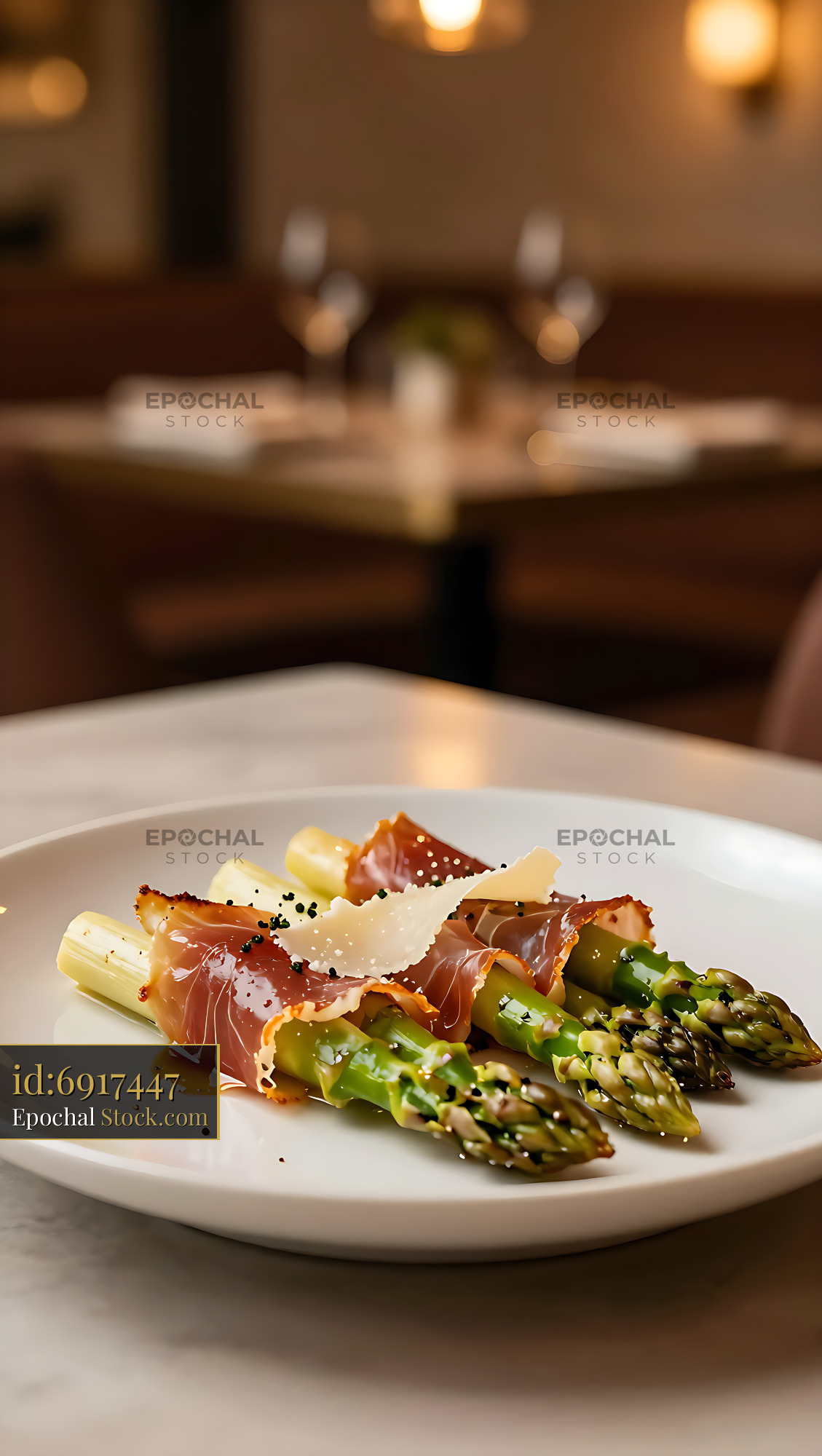 Involtini di prosciutto e asparagi served on a white plate - stock photo