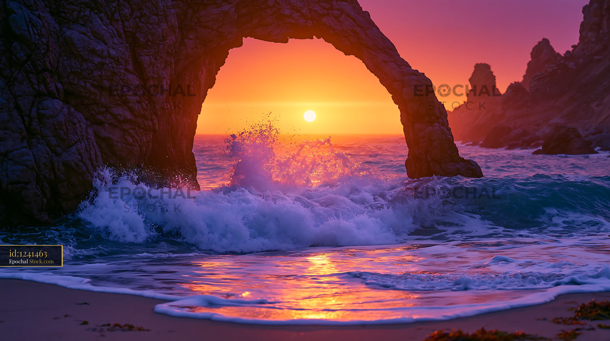 Natural rock arch at sunset with crashing waves in the Whitsundays - stock photo
