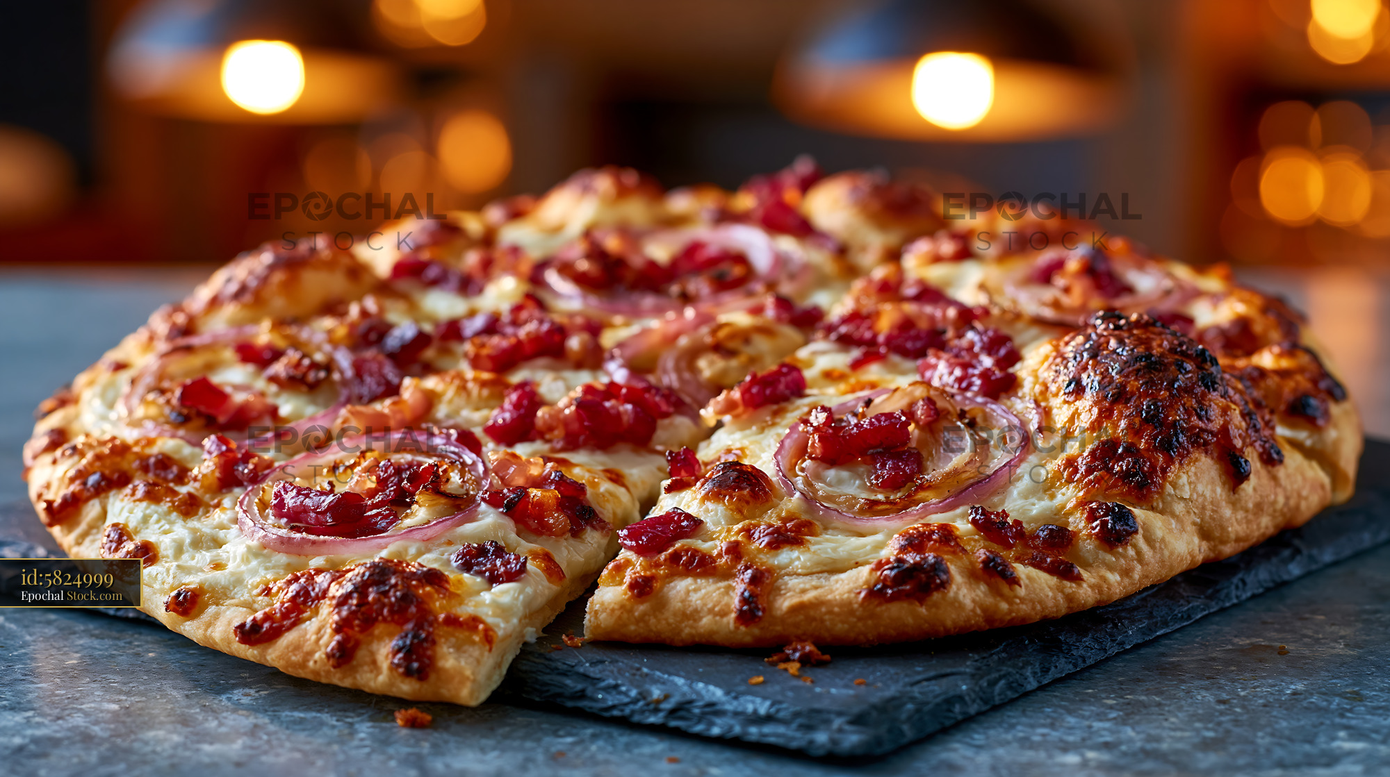 Freshly baked tarte flambee pizza with red onions and crispy bacon - stock photo