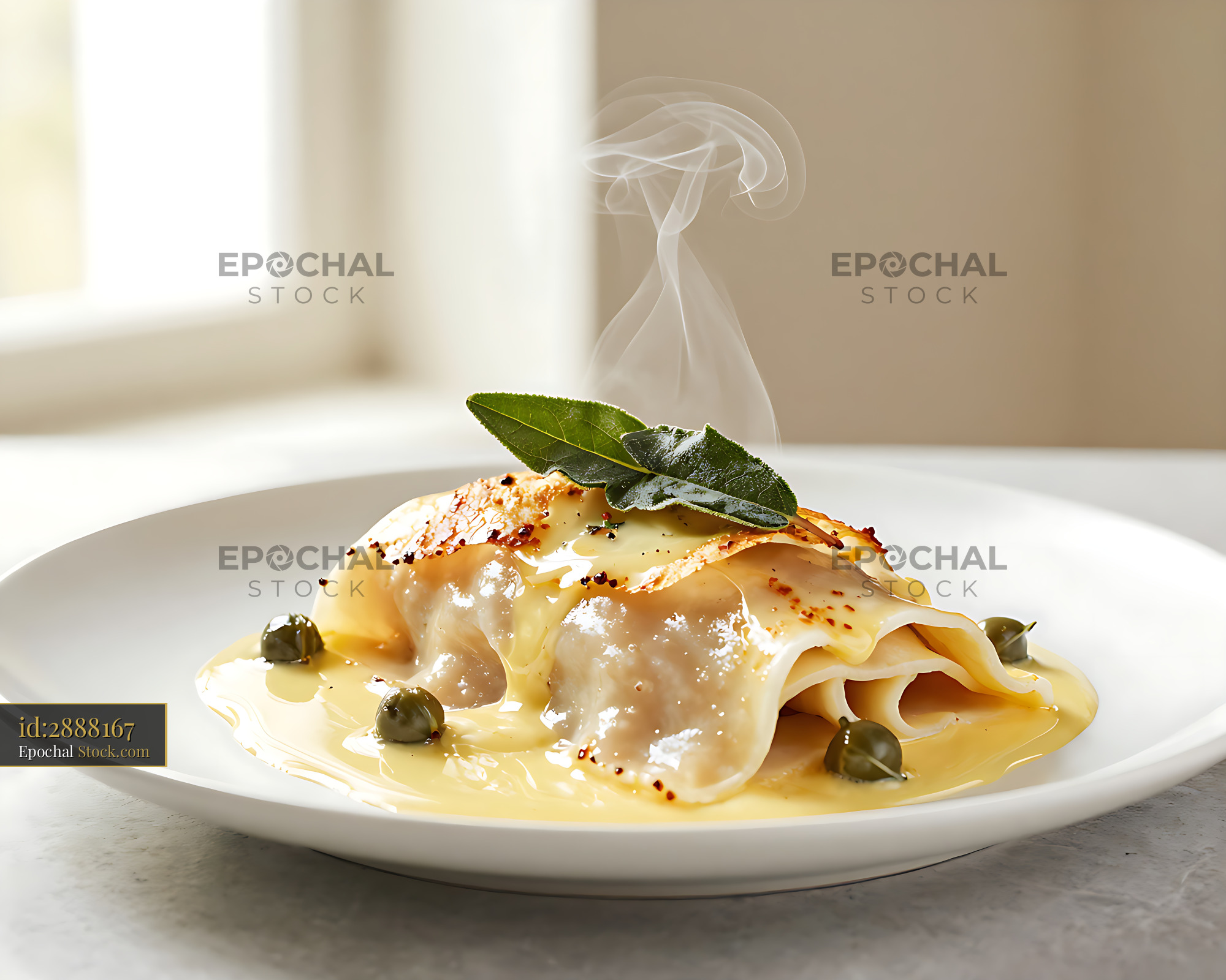 Saltimbocca alla Romana with fresh sage and capers on a white plate - stock photo