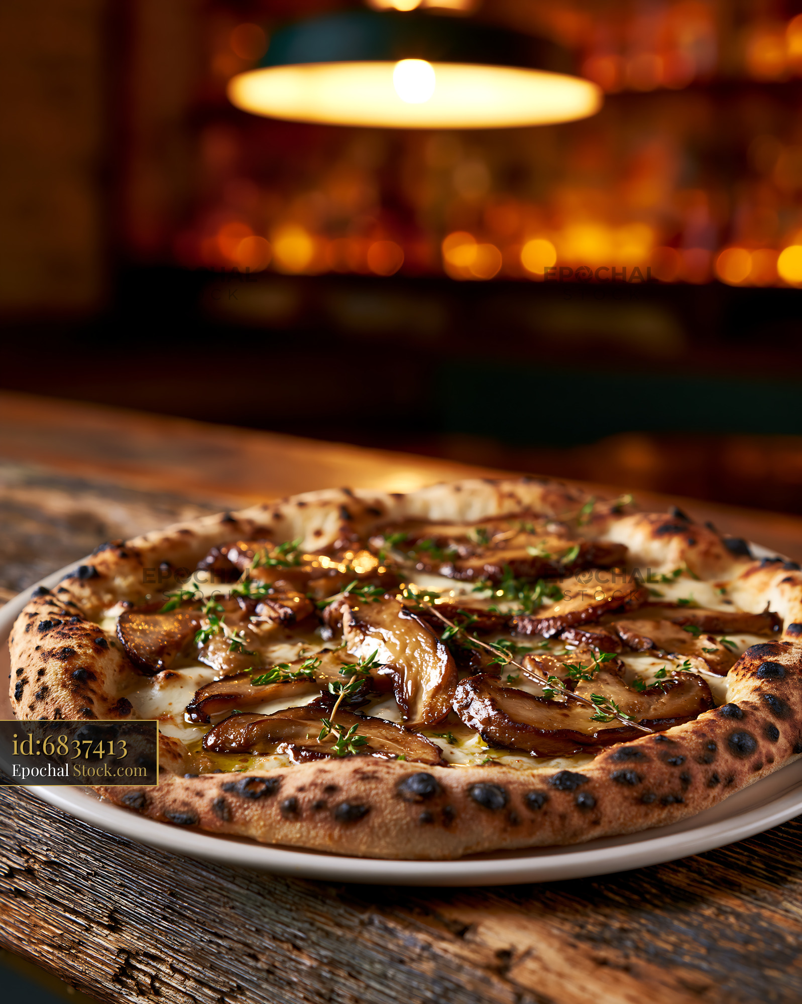 Gourmet Neapolitan pizza with porcini mushrooms and fresh thyme - stock photo