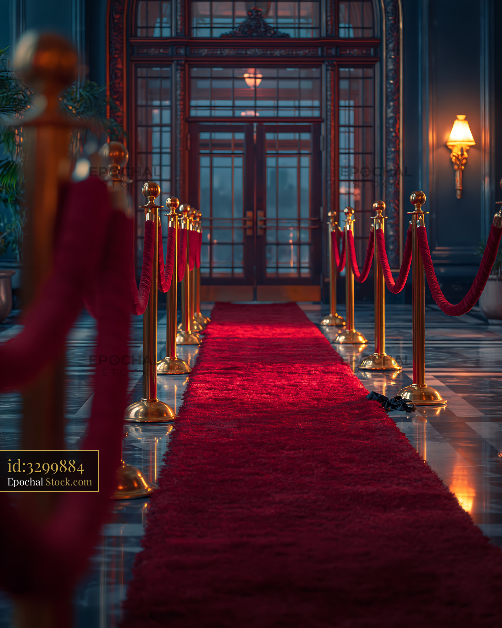 Red carpet entrance with gold stanchions for a luxury award ceremony - stock photo