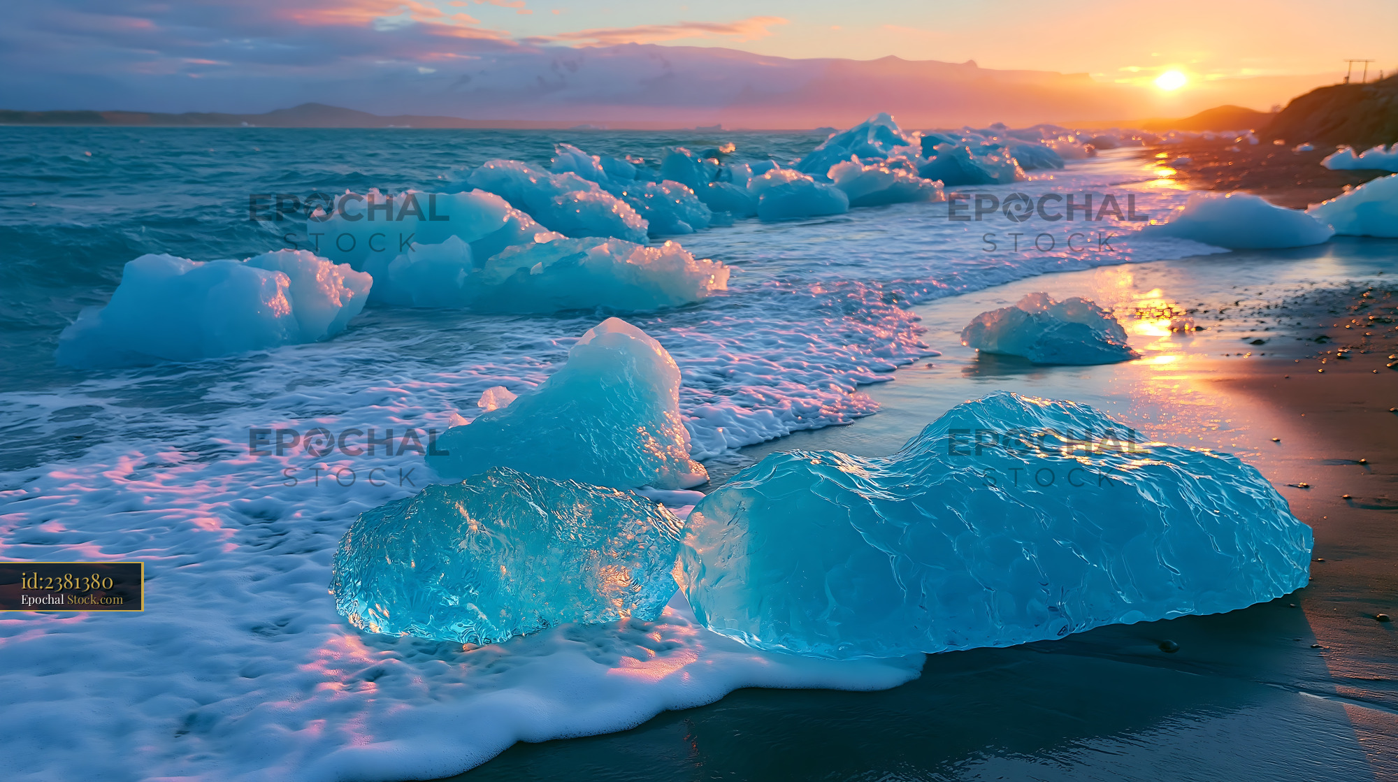Blue icebergs on black sand beach during a vibrant sunset - stock photo