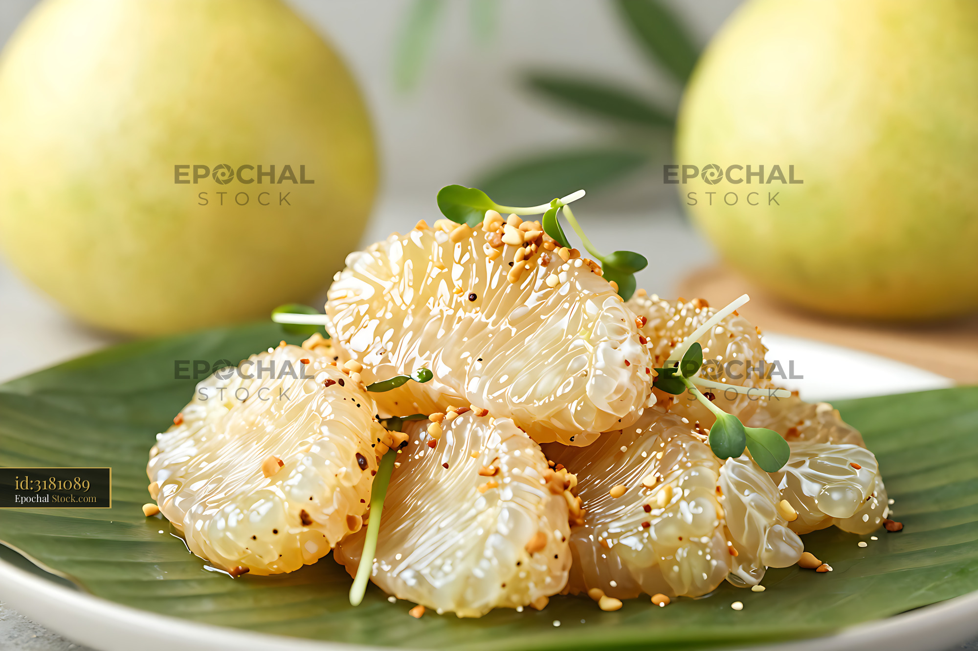 Thai Yam Som O pomelo salad segments served on a banana leaf - stock photo