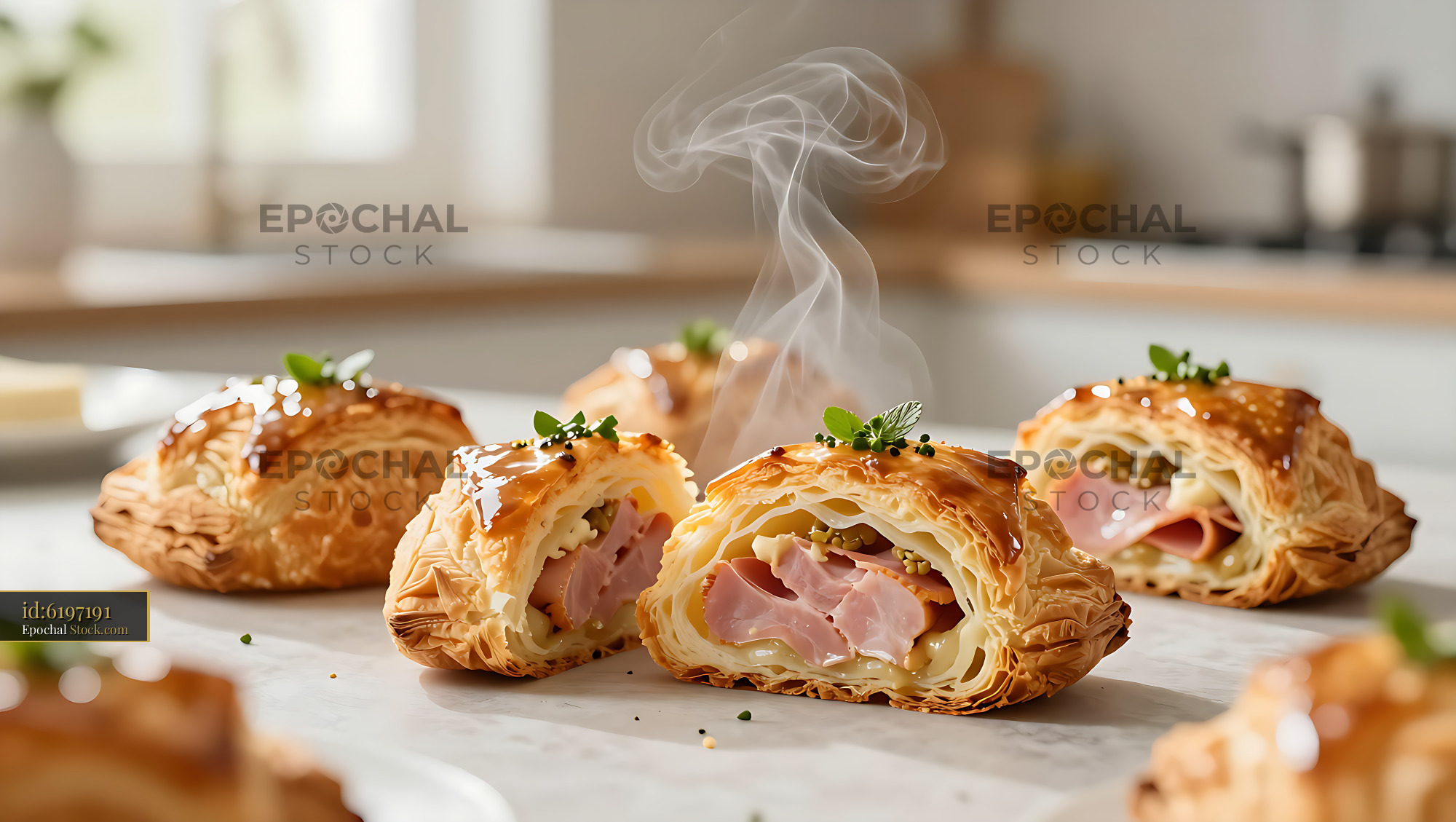 Freshly baked friand au jambon with ham and cheese in a kitchen - stock photo