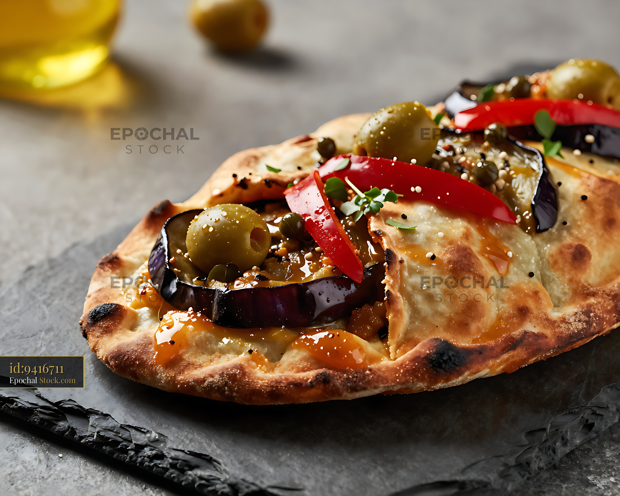 Gourmet calzone sicilian caponata-topped with eggplant and olives - stock photo