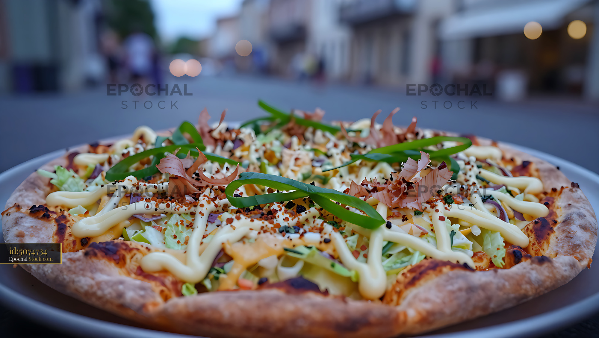 Japanese okonomiyaki pizza hybrid served at an outdoor restaurant - stock photo