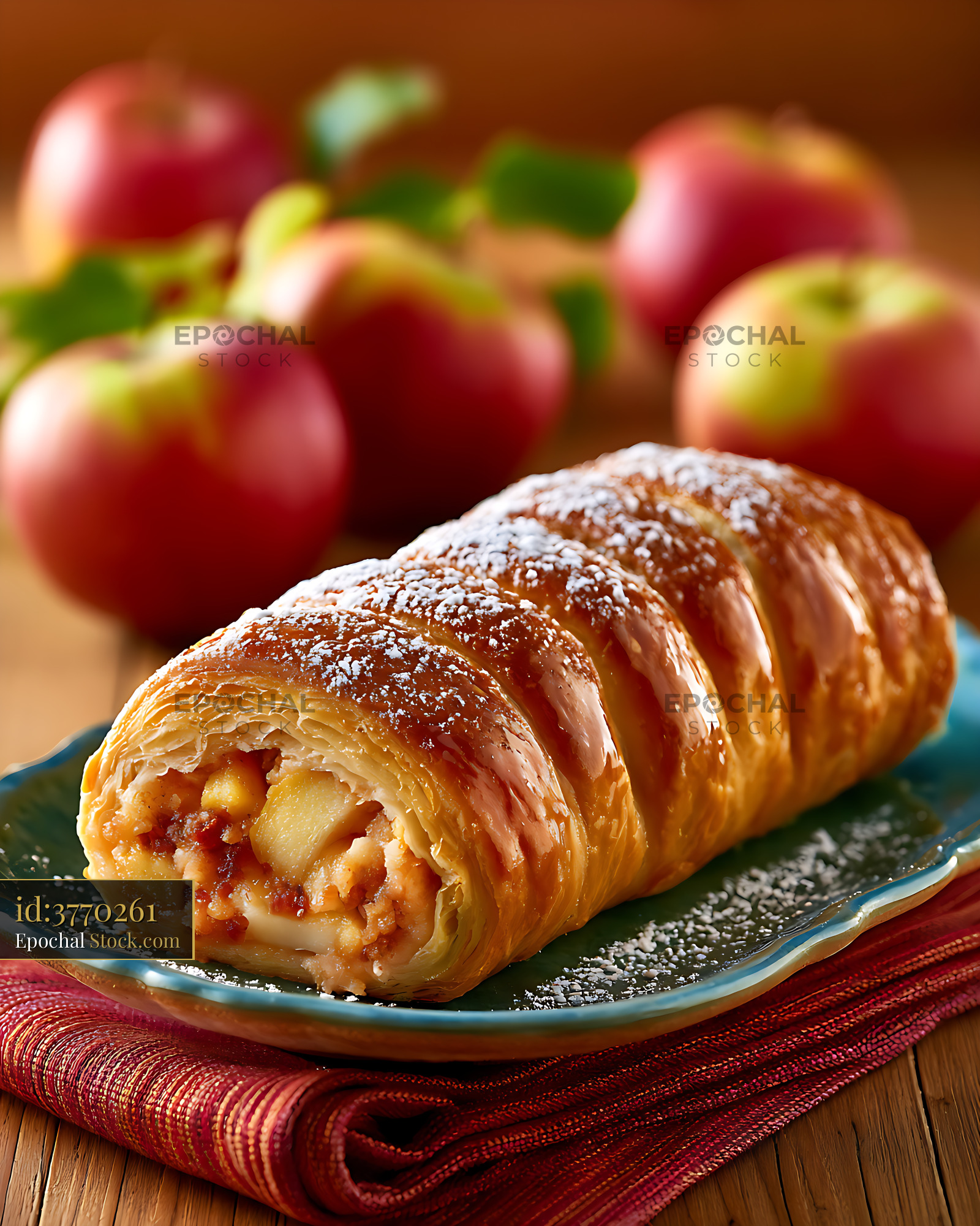 Freshly baked apple strudel with powdered sugar and red apples - stock photo