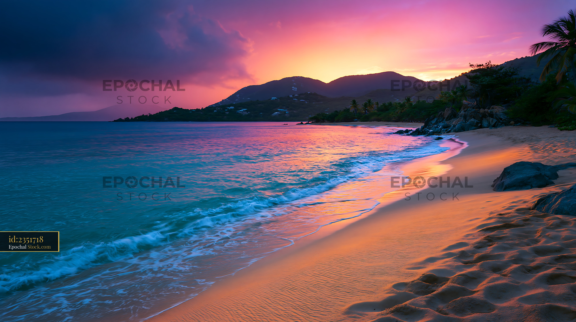 Tropical beach at sunset with vibrant pink and purple sky - stock photo