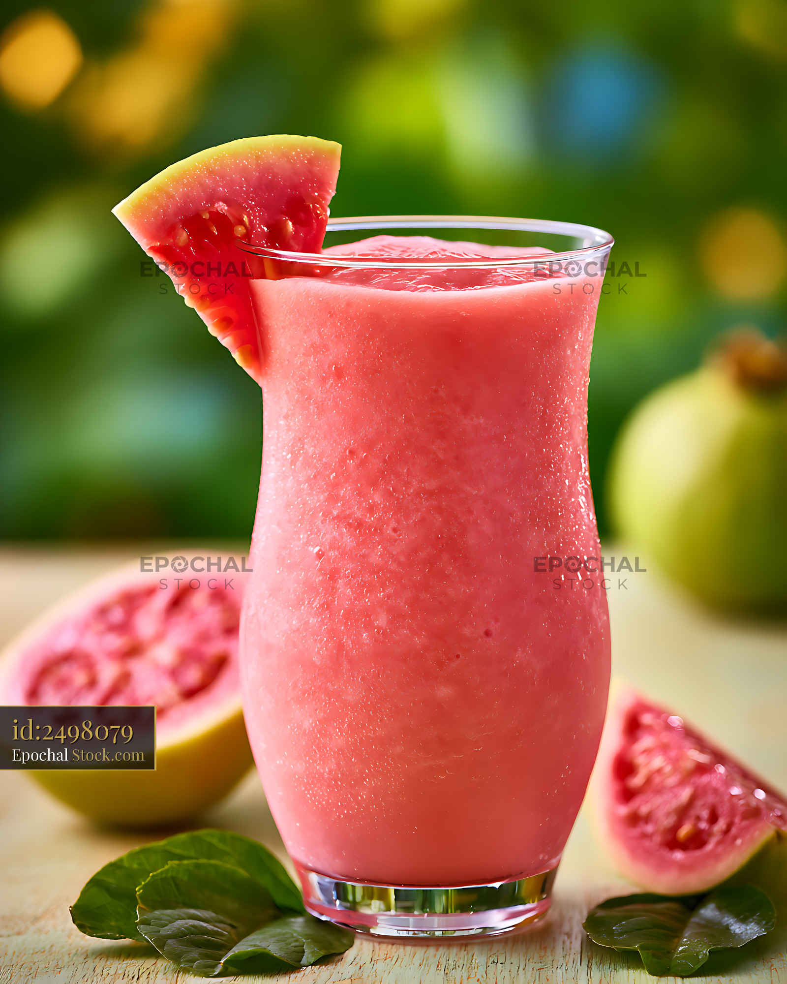 Refreshing pink guava tropical smoothie with fresh fruit garnish - stock photo