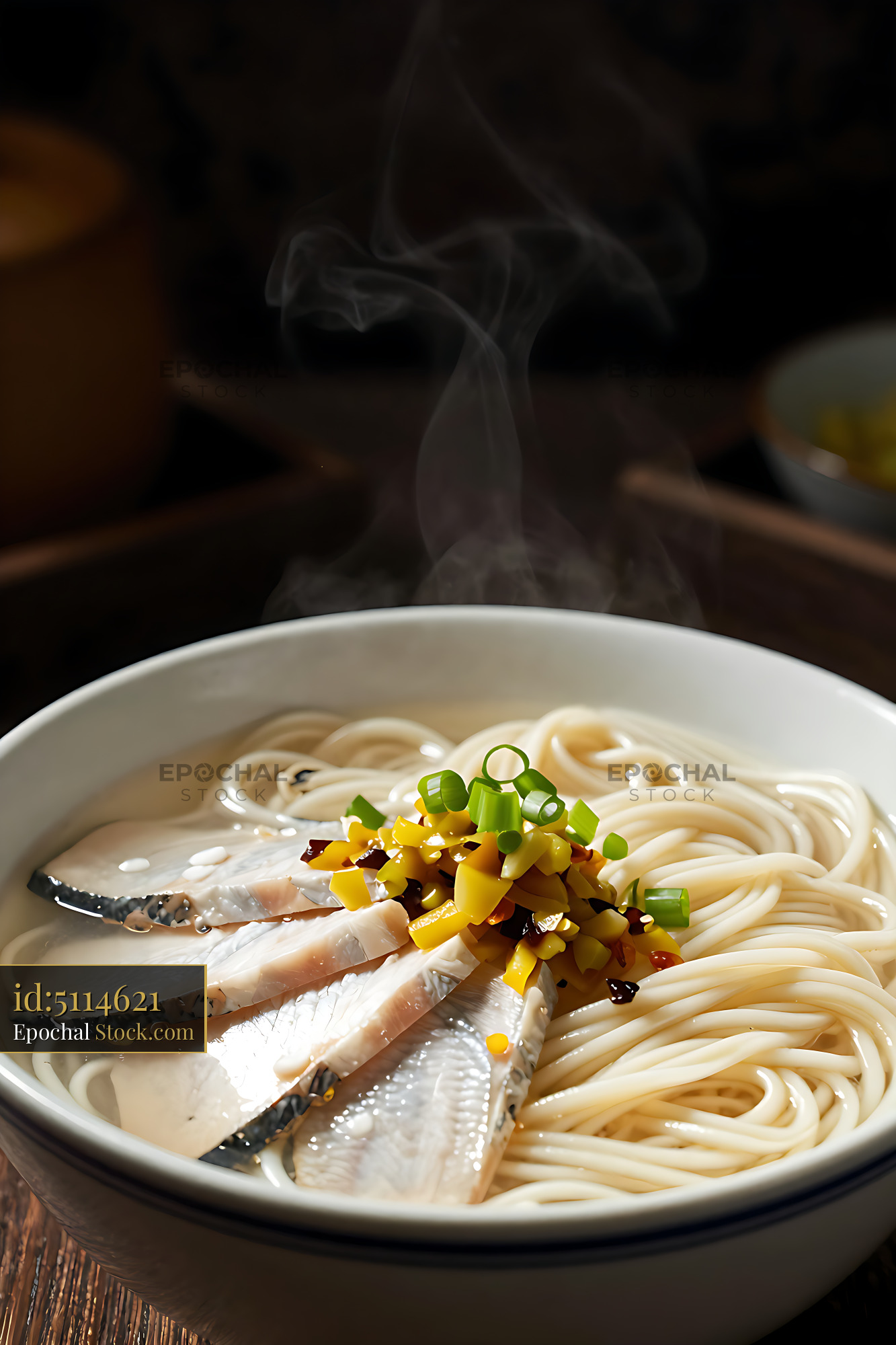 Steaming bowl of Ningbo Niang Mian with fish and pickled vegetables - stock photo