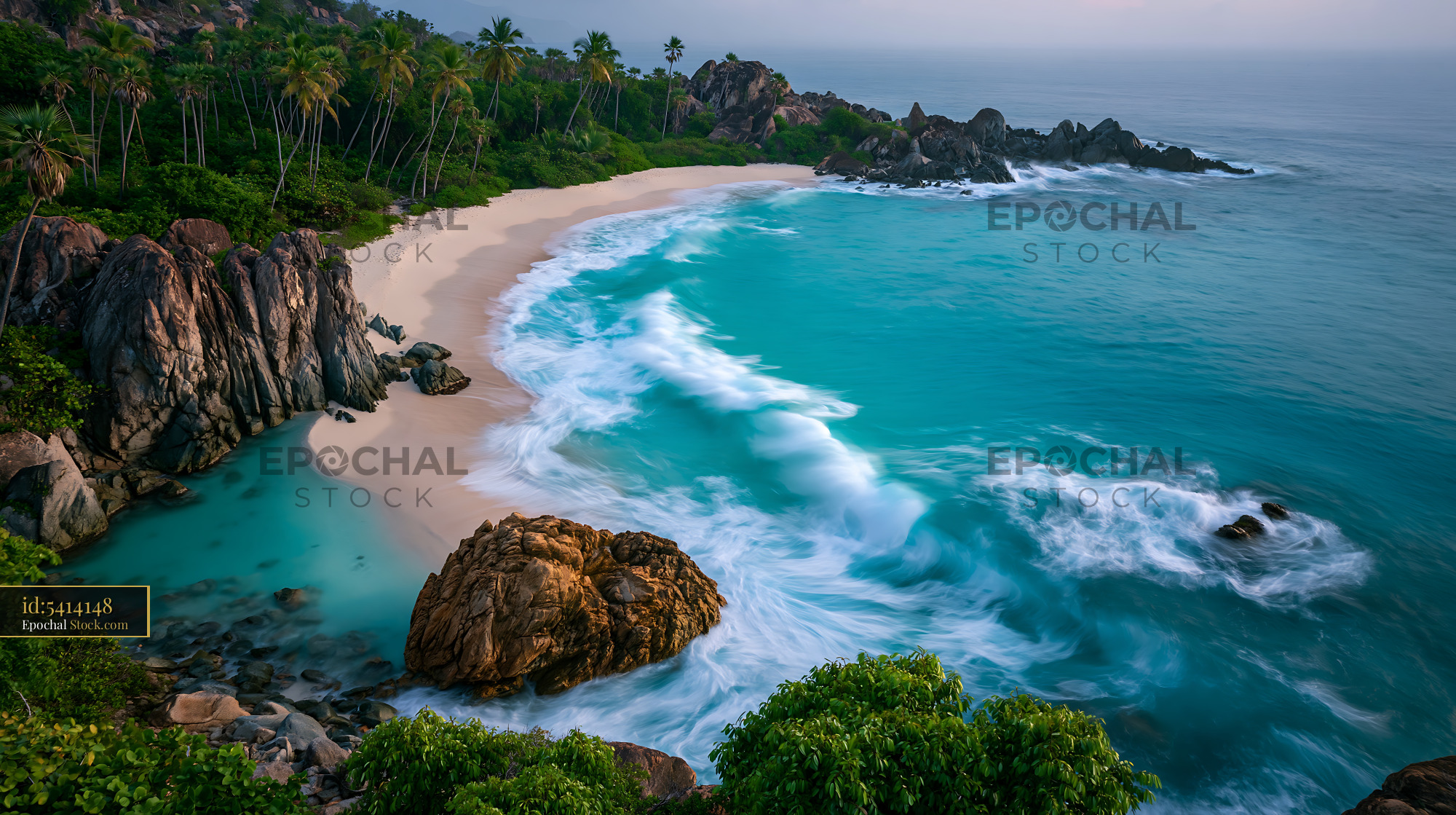Pristine tropical bay with turquoise waves and lush palm trees - stock photo