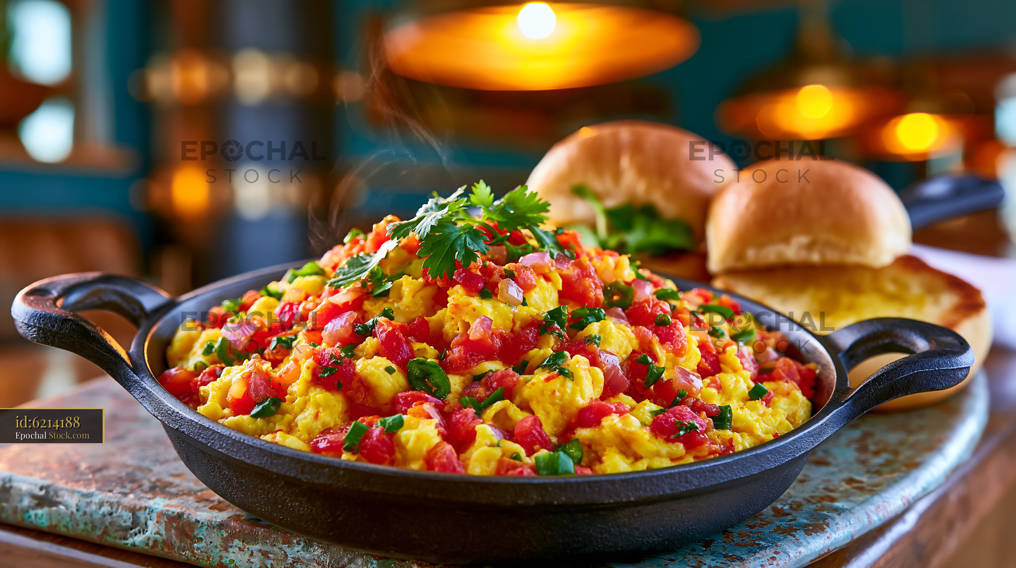 Egg bhurji egg food served in a cast iron skillet with pav bread - stock photo