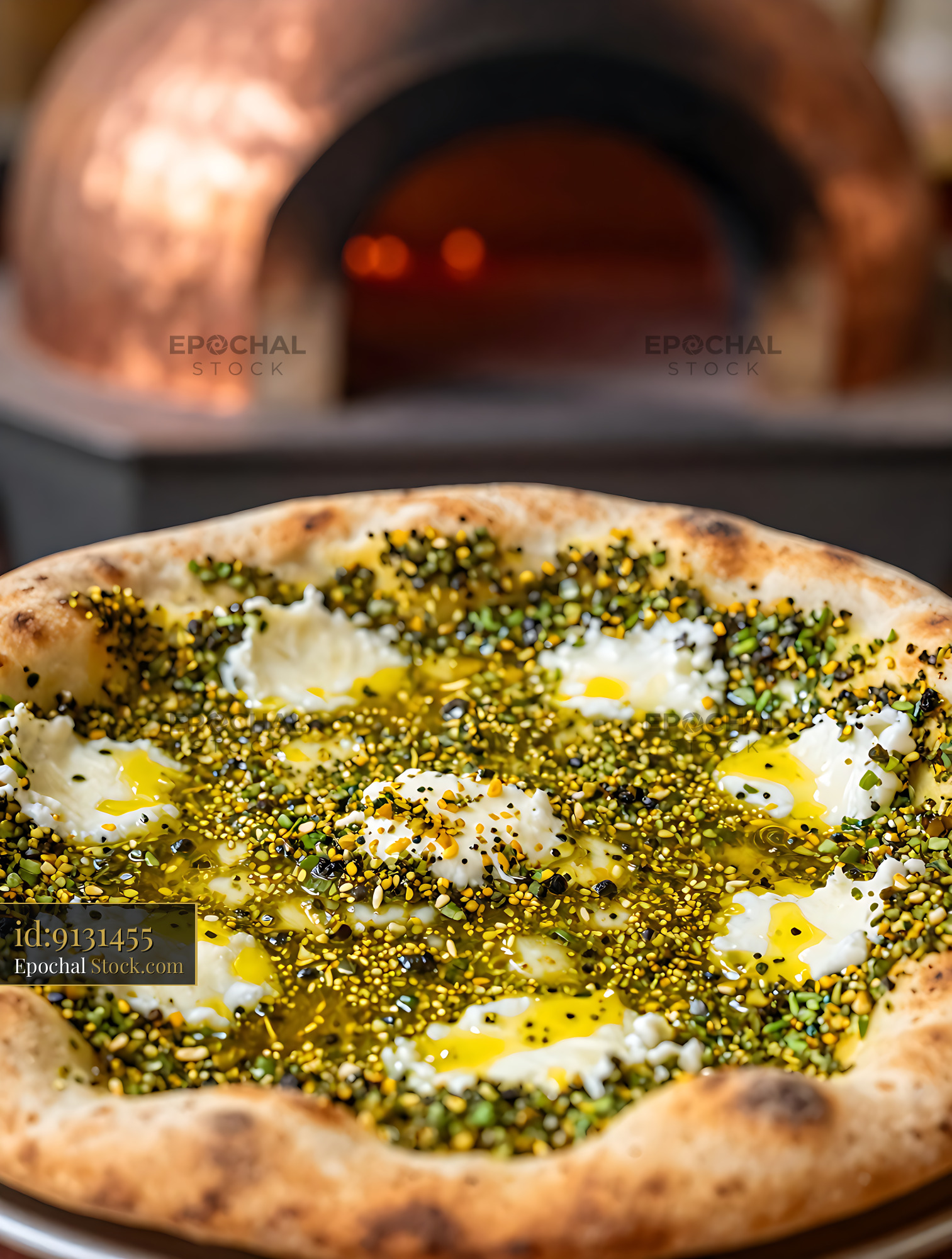 Freshly baked Lebanese Manakish Zaatar with cheese and olive oil - stock photo