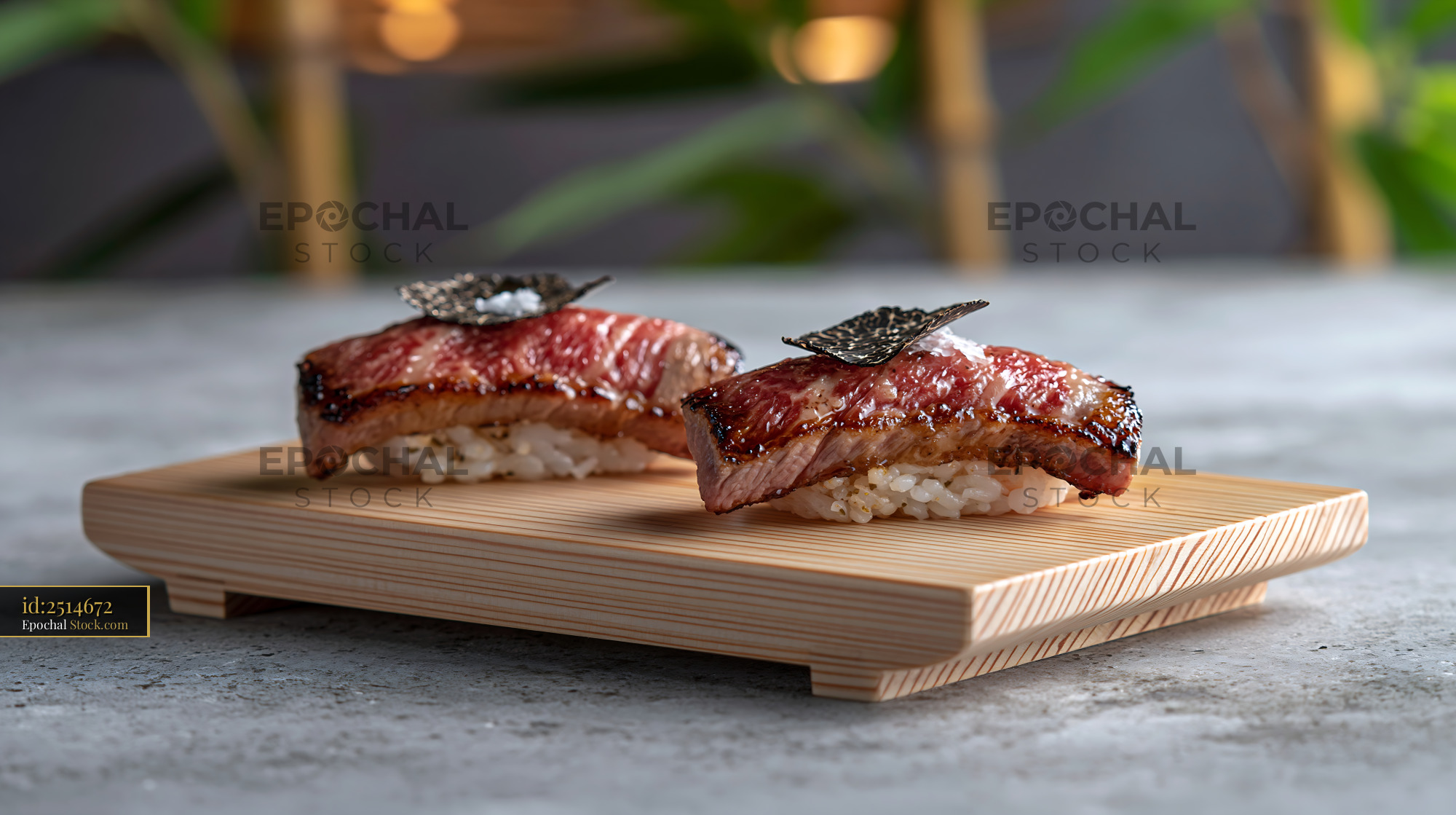 Seared wagyu beef nigiri sushi topped with black truffle and sea salt - stock photo