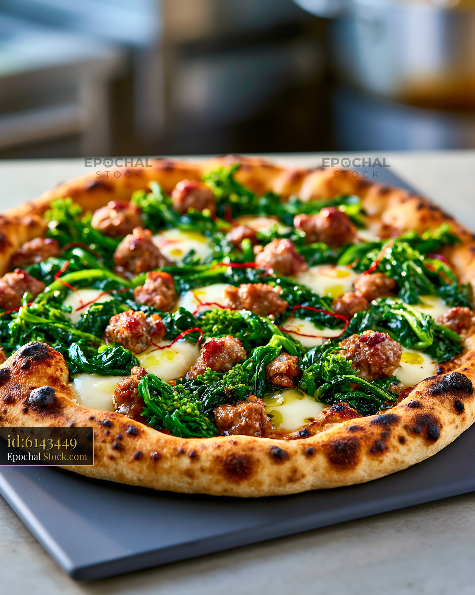 Gourmet Neapolitan friarielli sausage pizza with charred crust - stock photo
