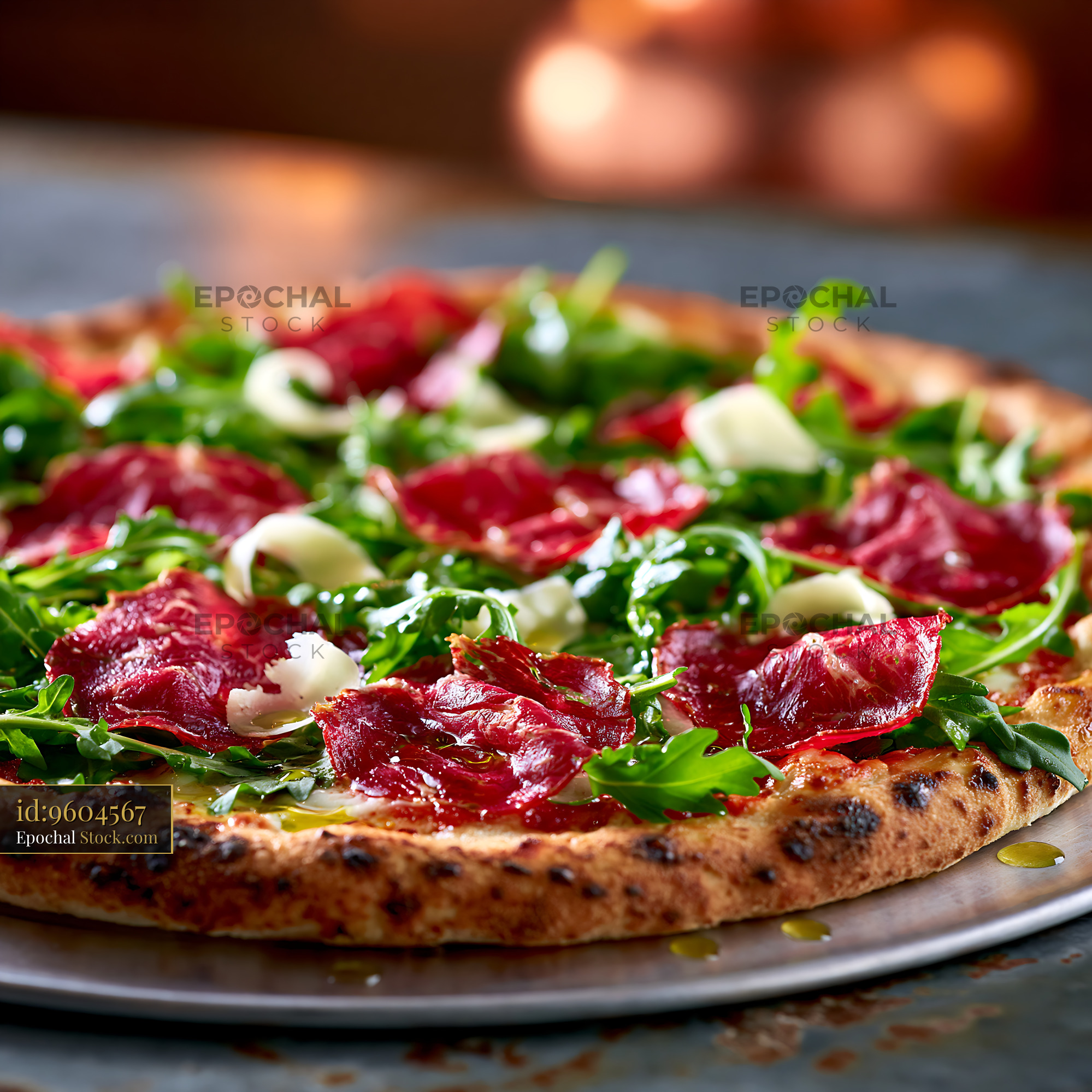 Neapolitan pizza topped with bresaola arugula and parmesan shavings - stock photo