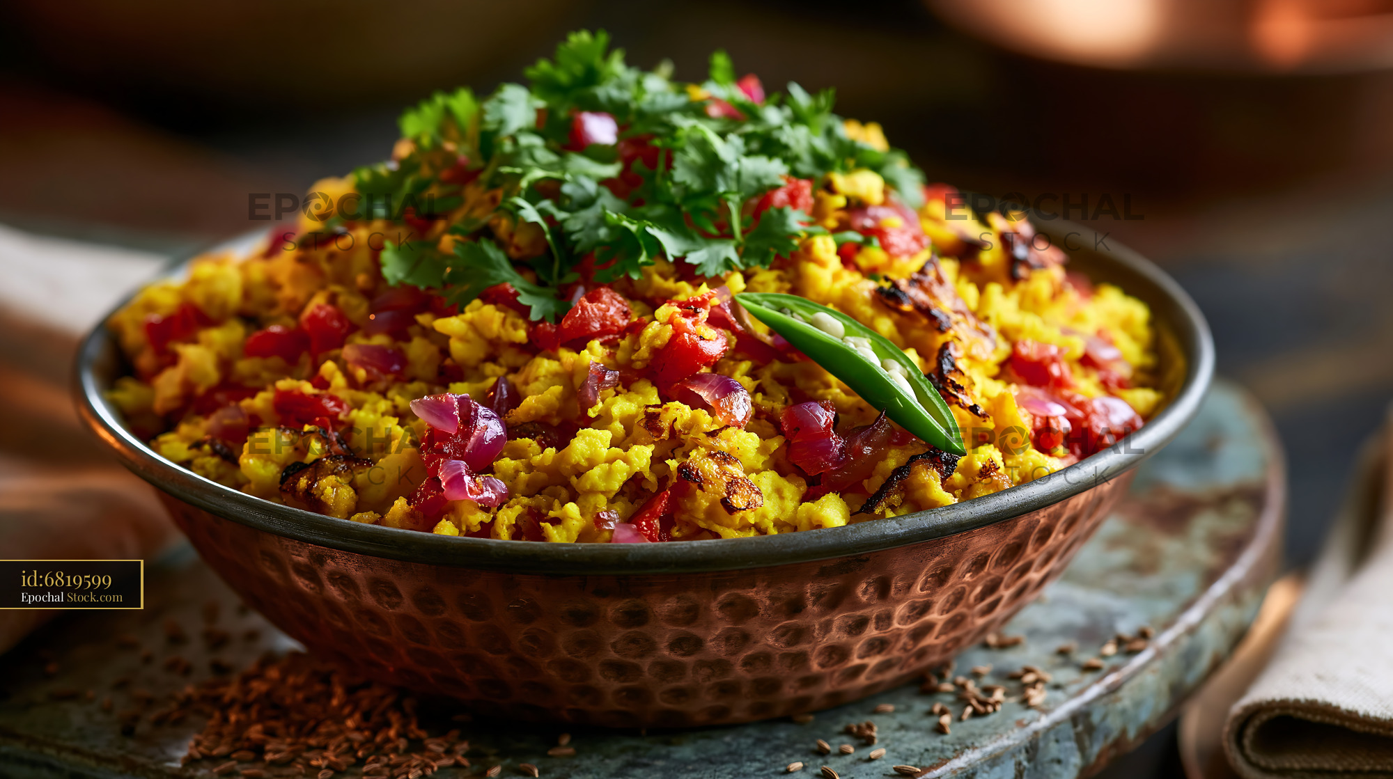 Indian egg bhurji with fresh cilantro in a copper bowl - stock photo