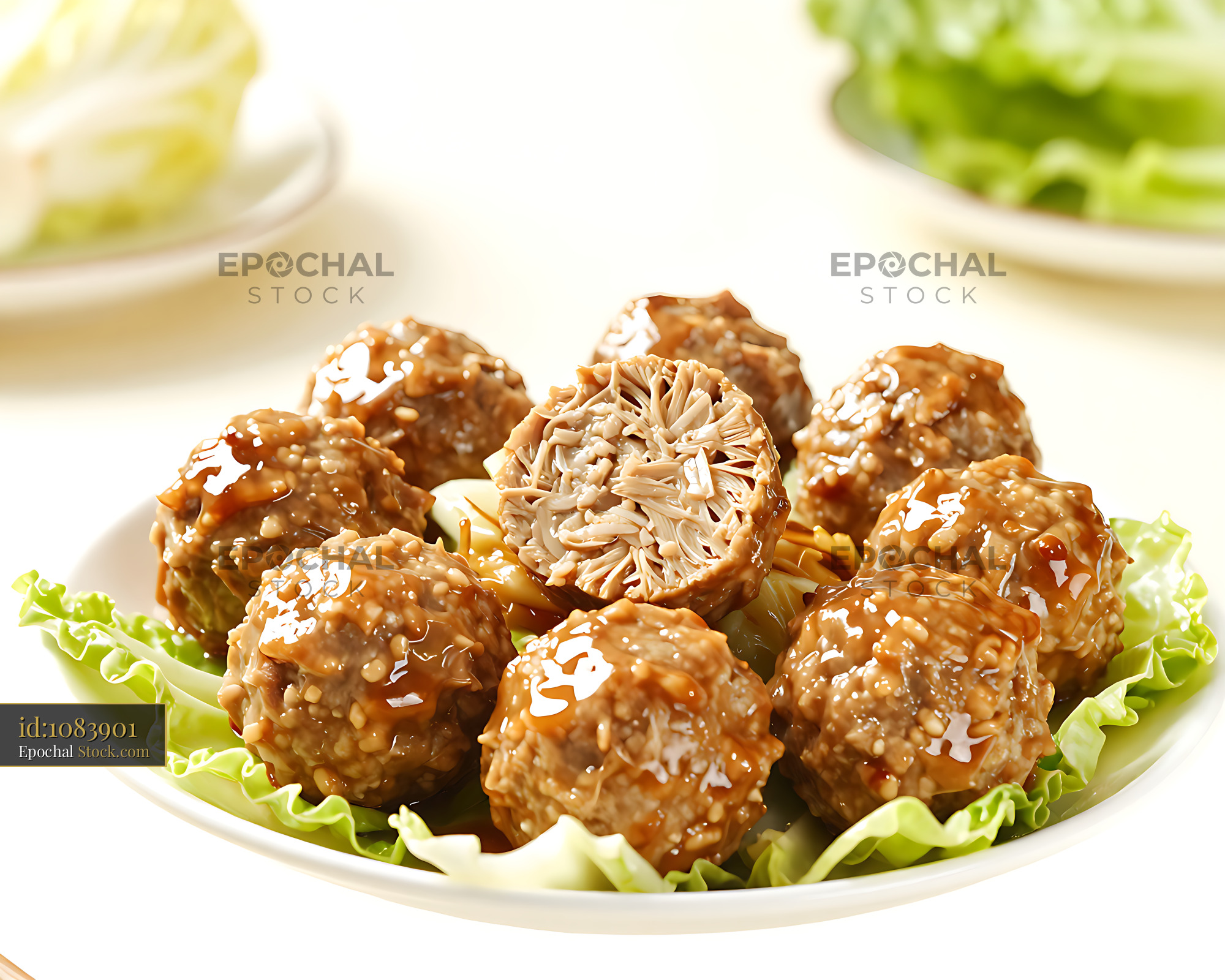 Traditional Jiangsu Lion's Head Meatballs with glaze on fresh lettuce - stock photo