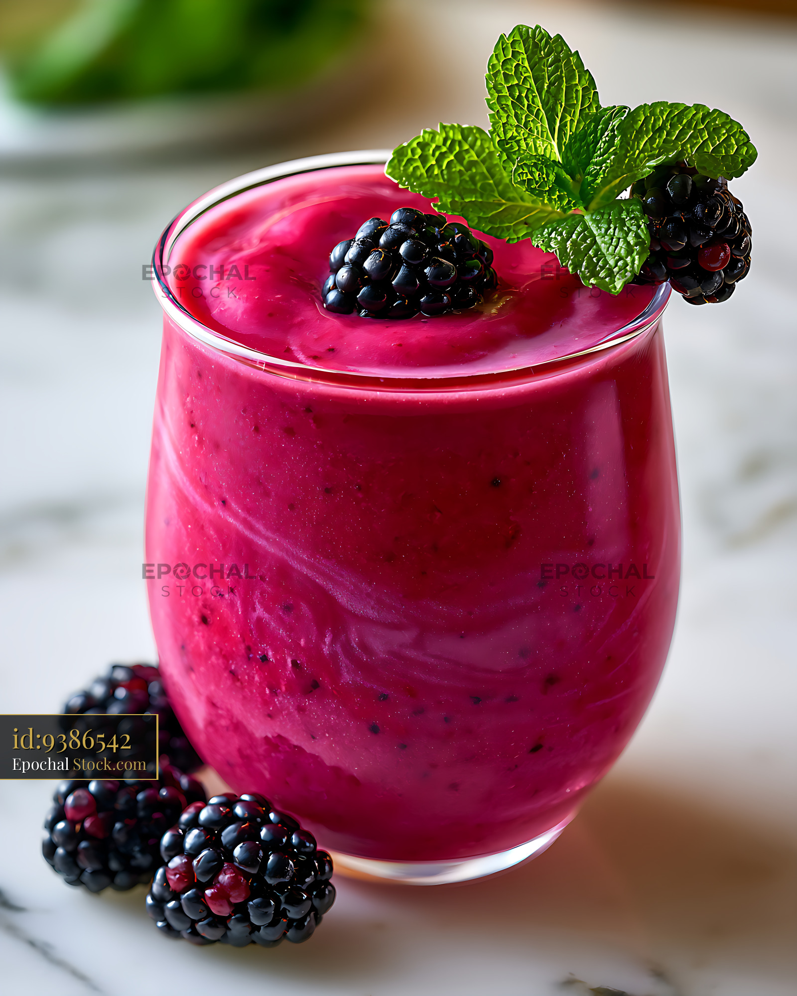 Refreshing blackberry mint smoothie in a glass on a marble table - stock photo