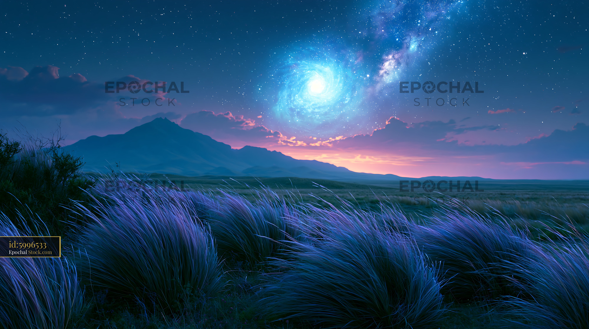 Vibrant spiral galaxy over a mystical mountain landscape at night - stock photo