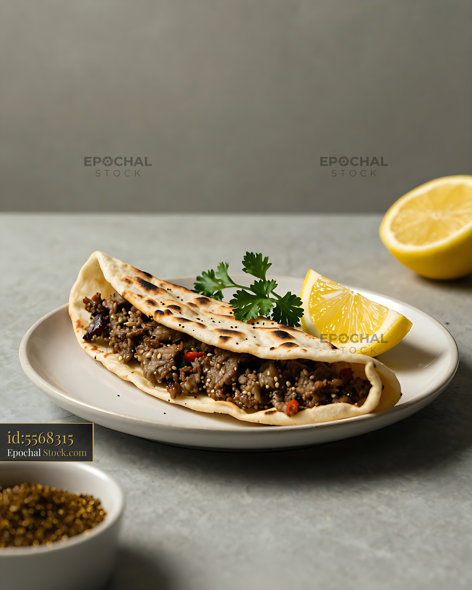 Iraqi-style lahm bi ajeen roll with seasoned minced meat and lemon - stock photo