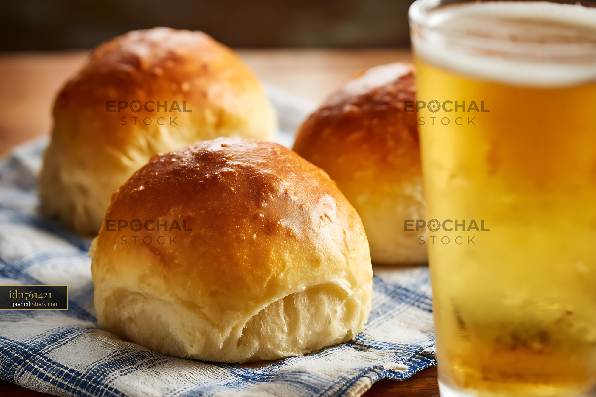 Golden Bierocks Pastry Rolls with Craft Beer on Checkered Kitchen Cloth - stock photo