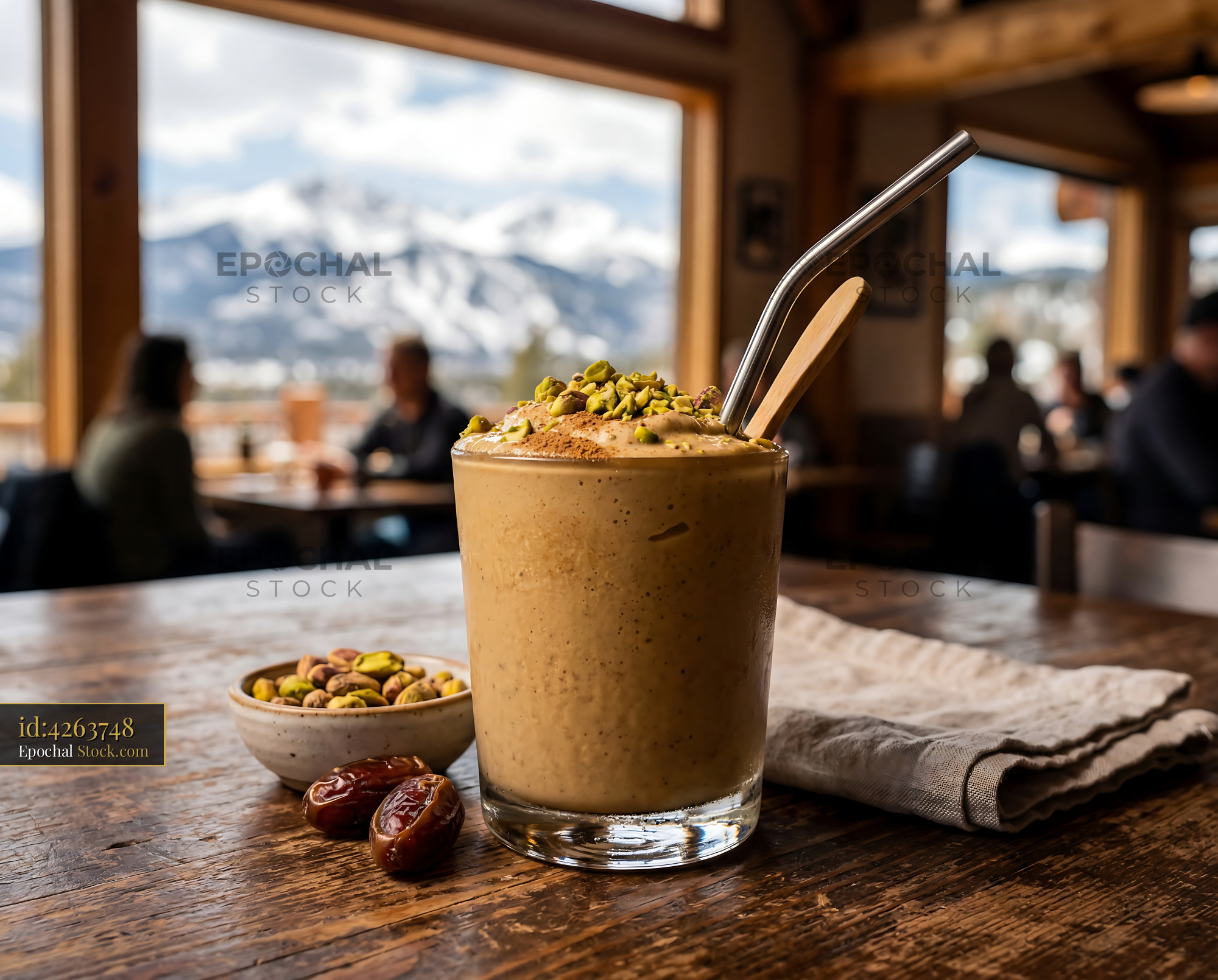 Tahini Date Shake Overlooking Snow Mountains - stock photo