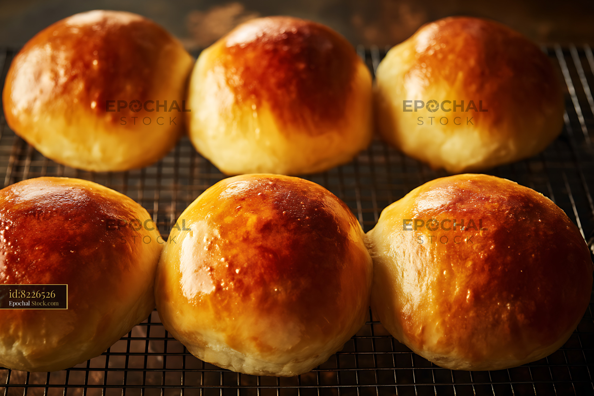 Freshly Baked Bierocks with Golden Brown Crust Cooling on Wire Rack - stock photo