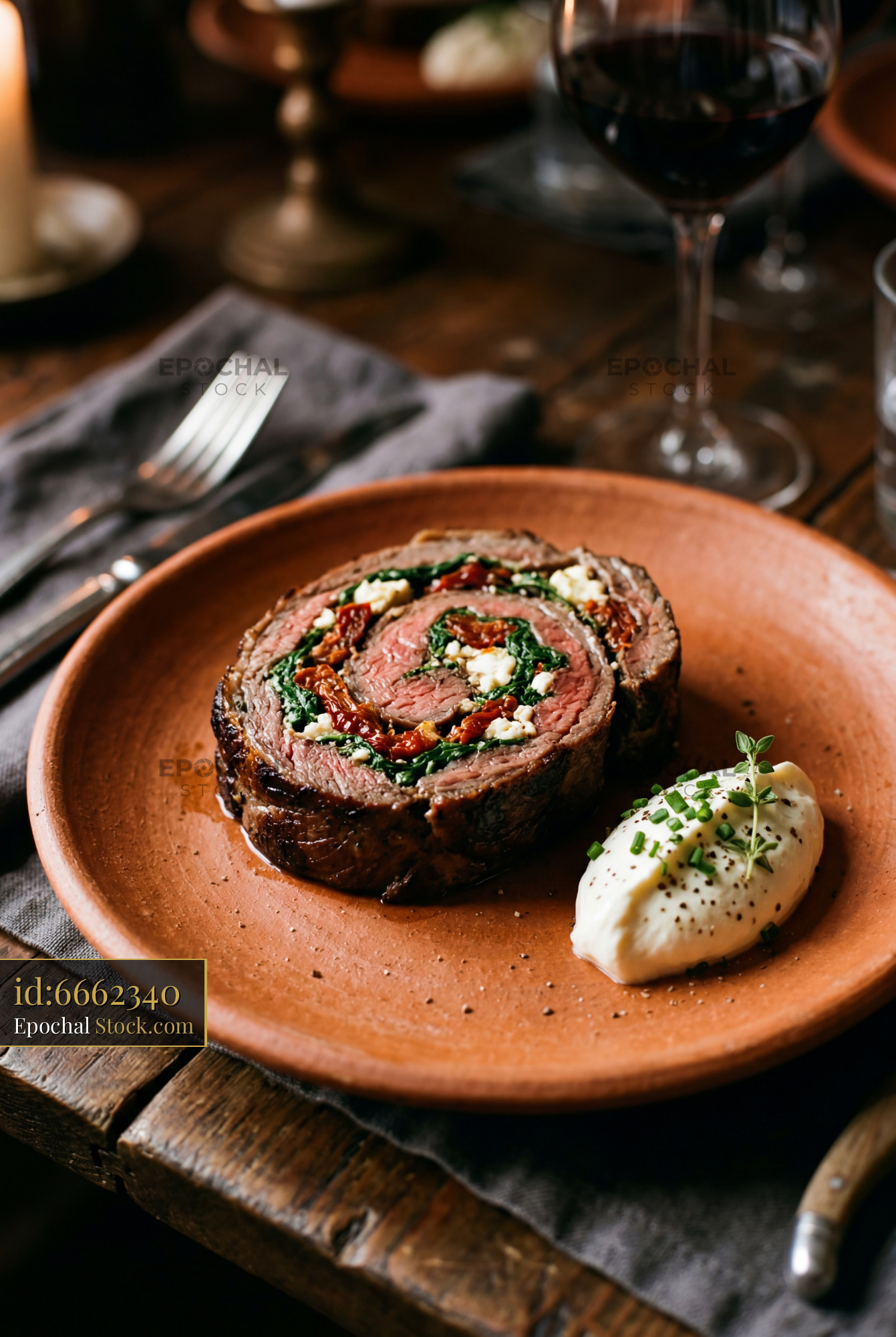 Beef Roulade with Spinach and Feta on Clay Plate - stock photo