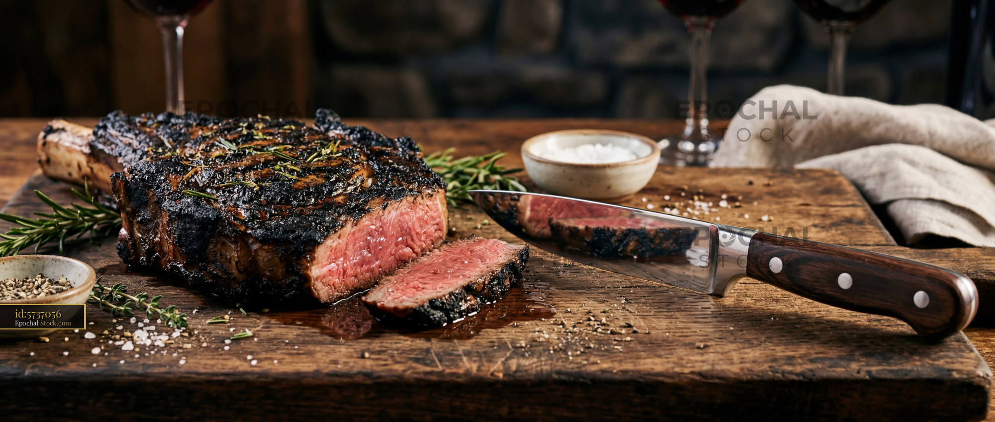 Gourmet Steak Sliced on Rustic Cutting Board - stock photo